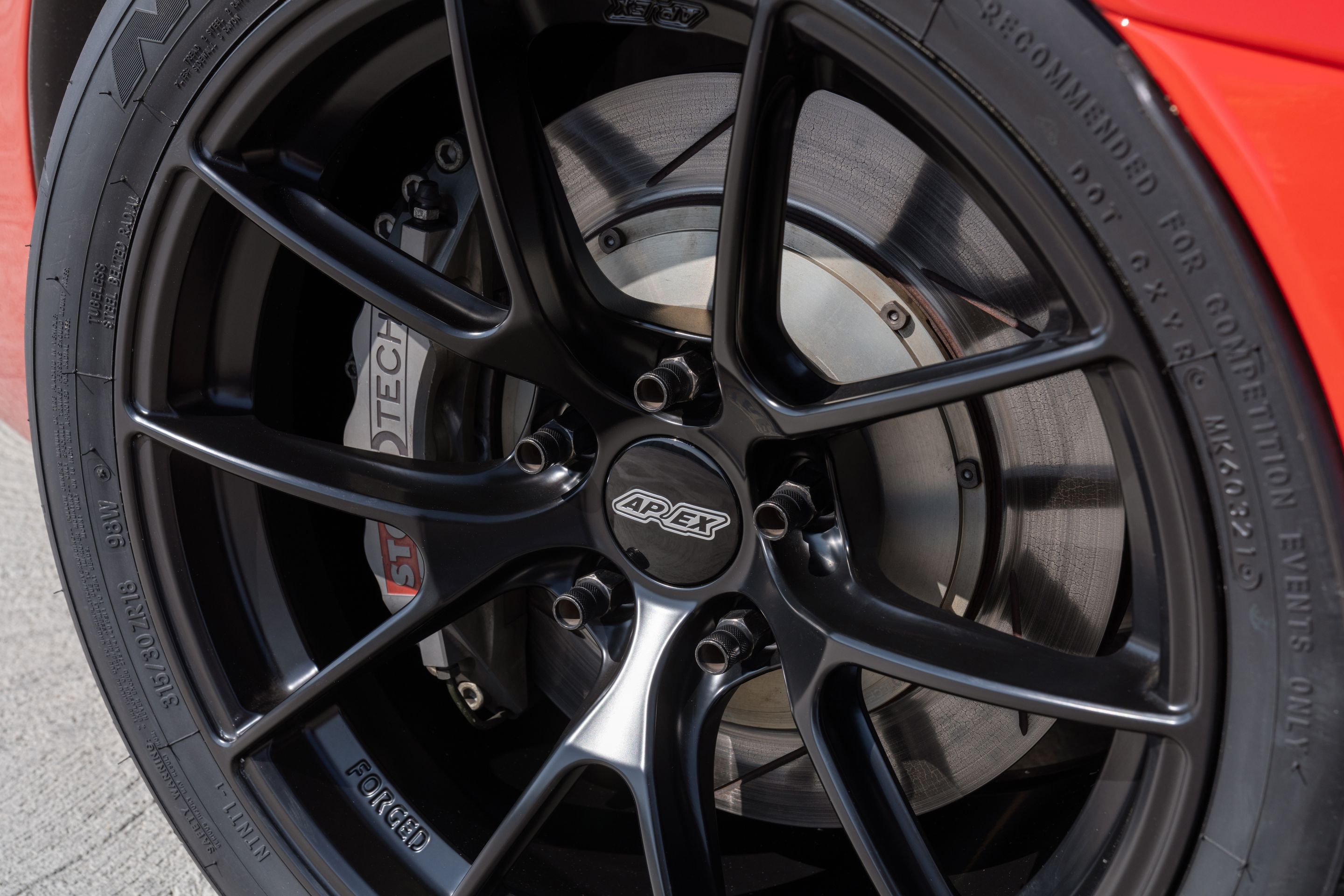 Red Chevrolet C6 Corvette Z06 with 18" VS-5RS Apex wheels in Satin Black