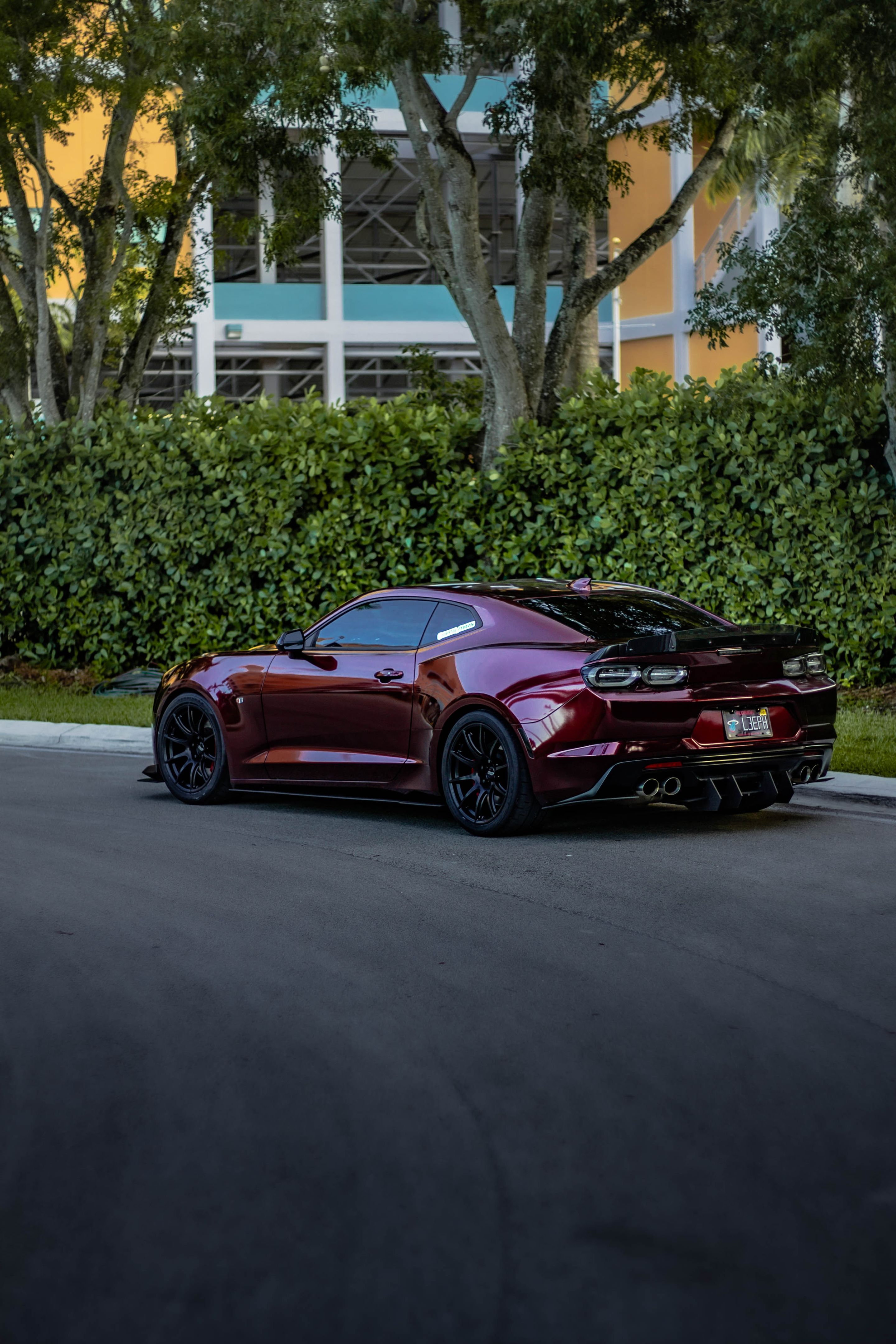 Red Chevrolet 6th Gen Camaro SS with 19" SM-10 Apex wheels in Satin Black