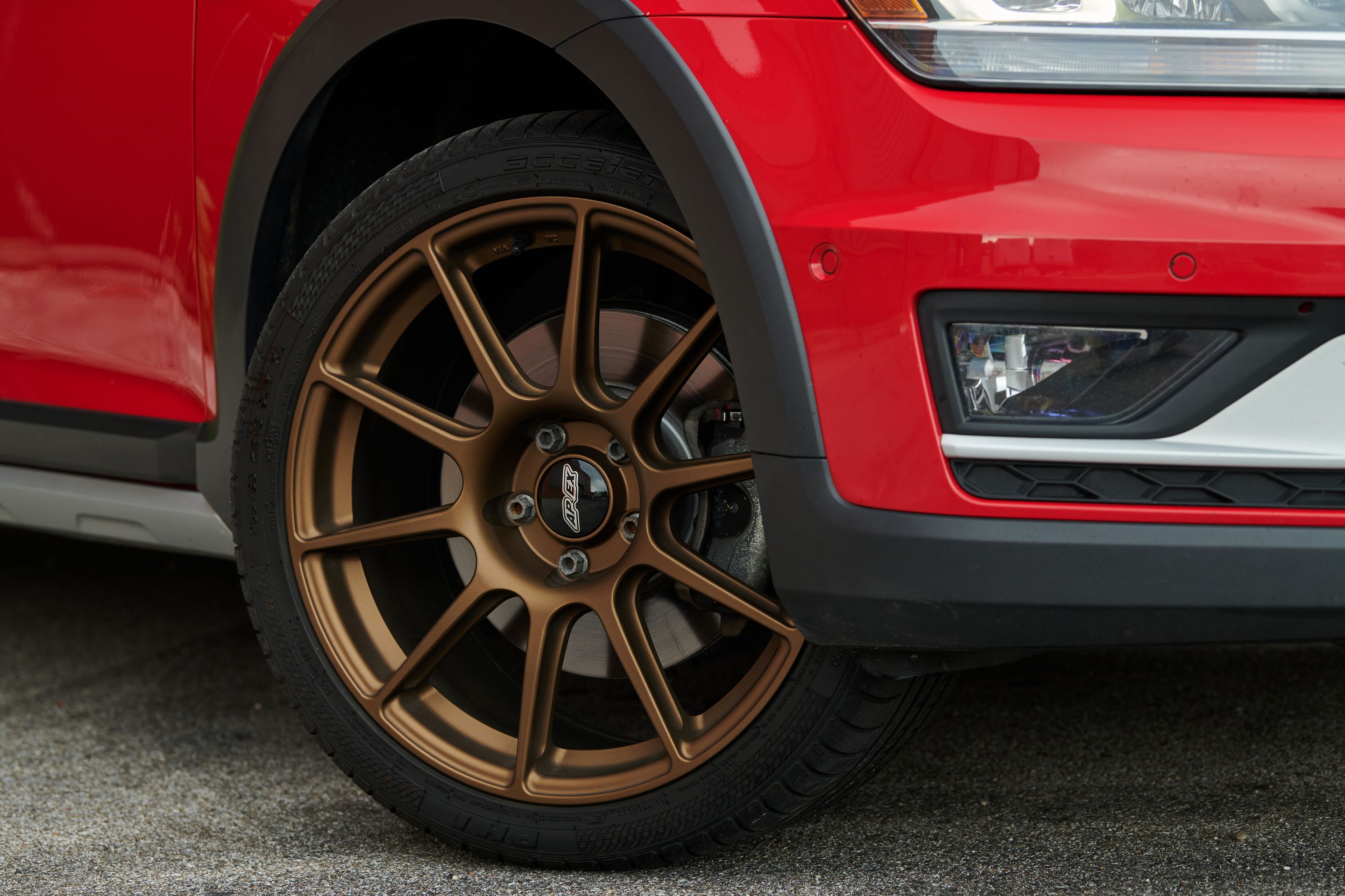 Red VW MK7 Alltrack/SportWagen Alltrack with 18" SM-10 Apex wheels in Satin Bronze