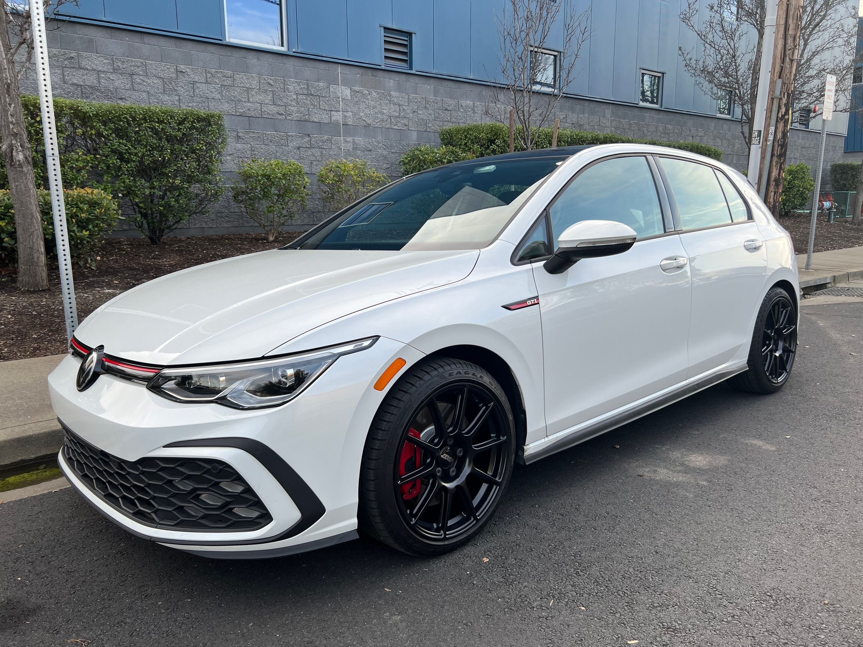 White VW MK8 GTI with 18" SM-10 Apex wheels in Satin Black