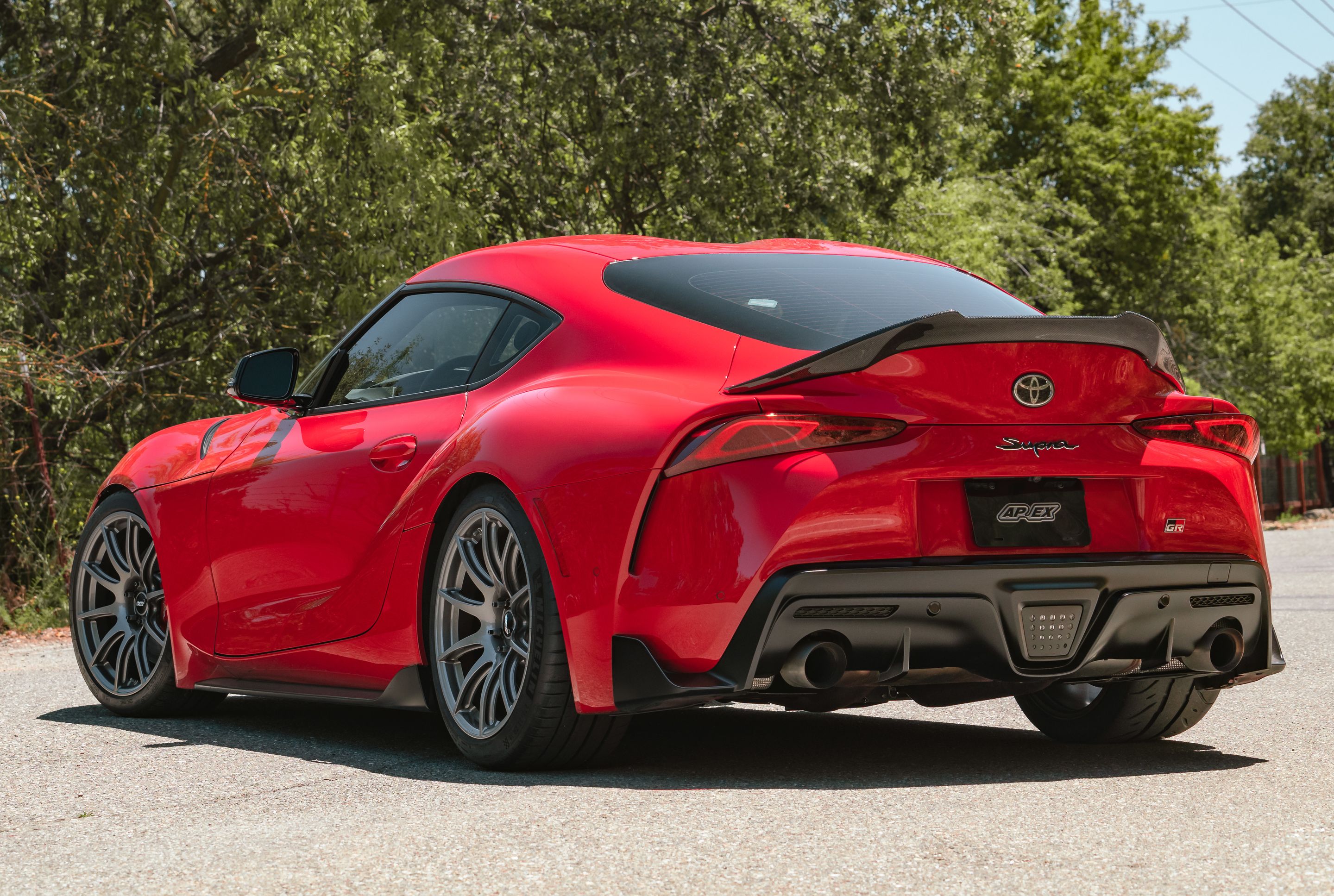 Red Toyota GR Supra with 19" SM-10 Apex wheels in Anthracite