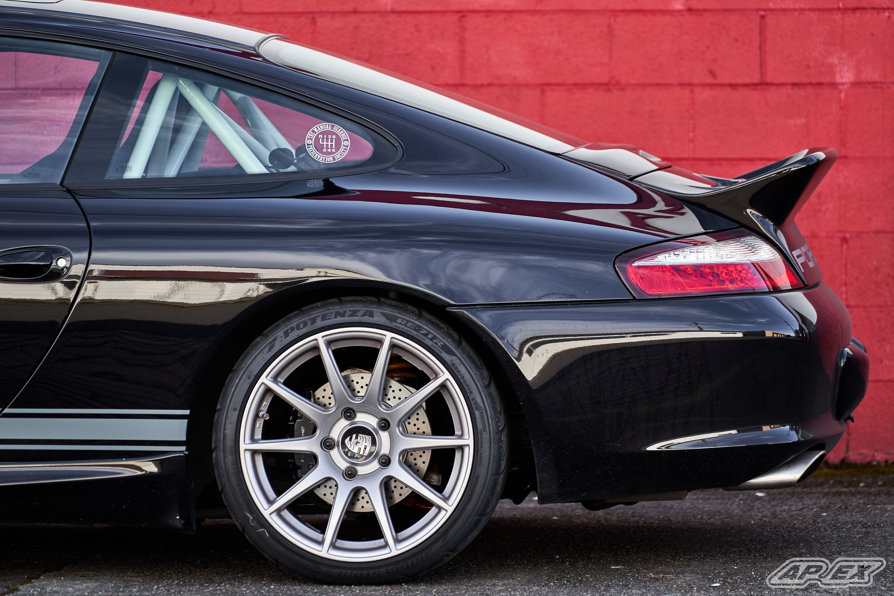 Black Porsche 911 996 Carrera with 18" SM-10 Apex wheels in Race Silver