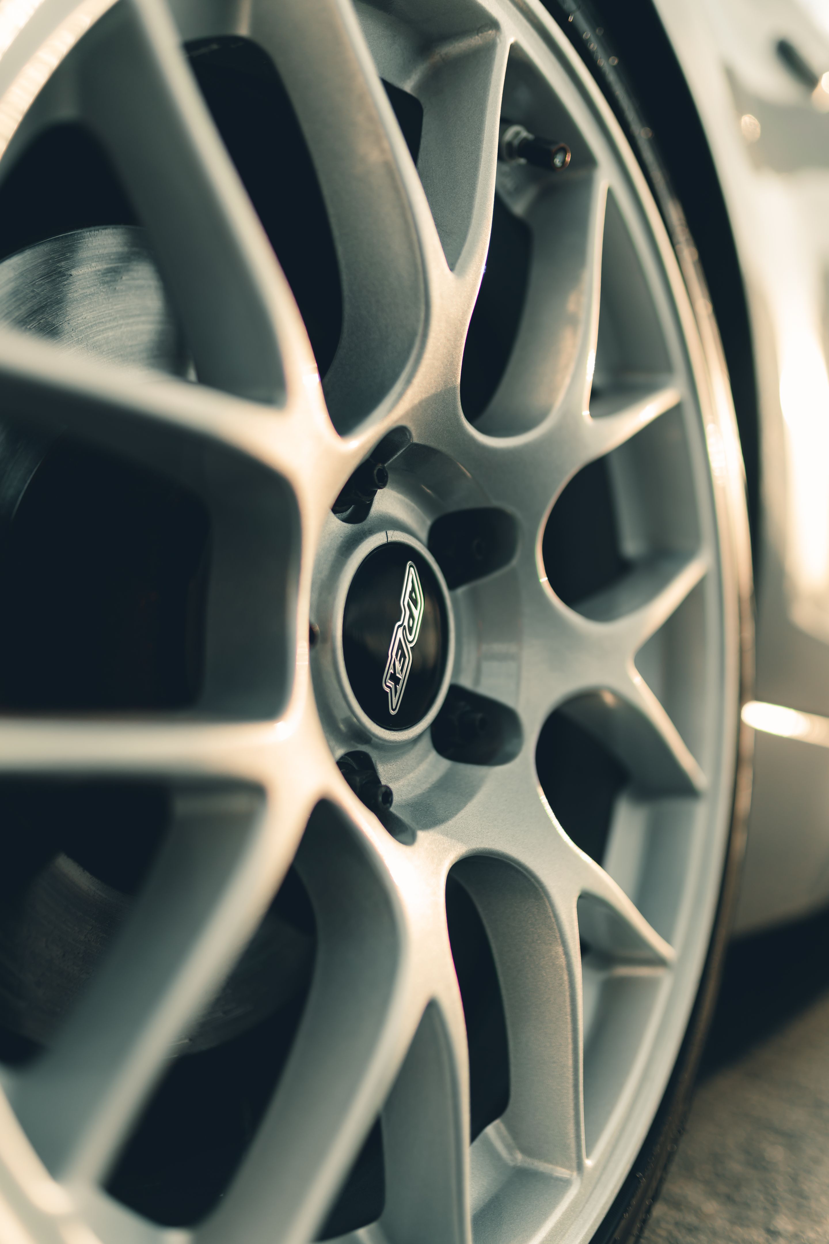 Grey BMW E82 Coupe 1 Series with 18" EC-7 Apex wheels in Race Silver