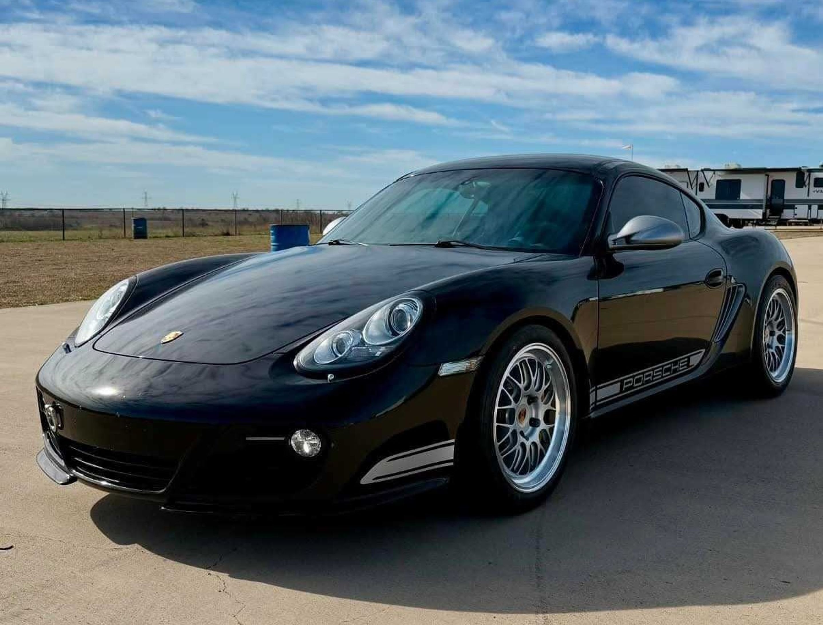 Black Porsche 987 Cayman R with 18" ML-10RT Apex wheels in Machined Lip Race Silver