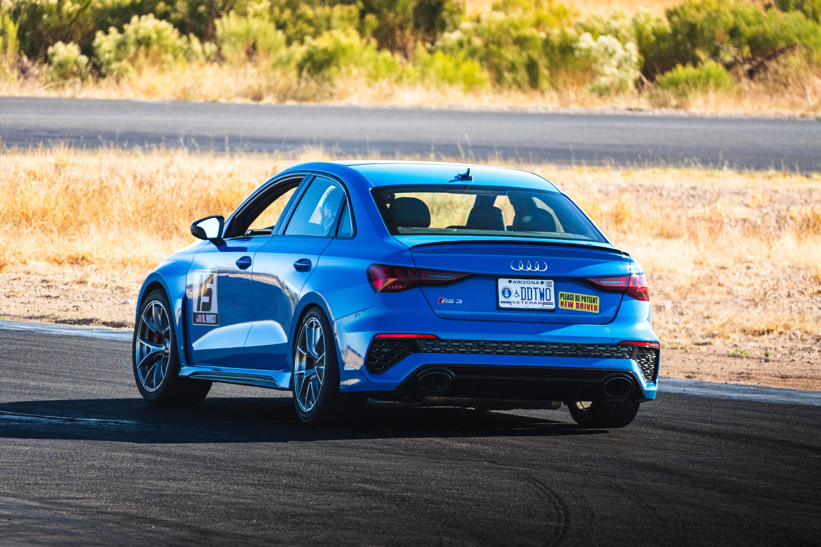 Blue Audi 8Y RS 3 with 18" VS-5RS Apex wheels in Brushed Clear