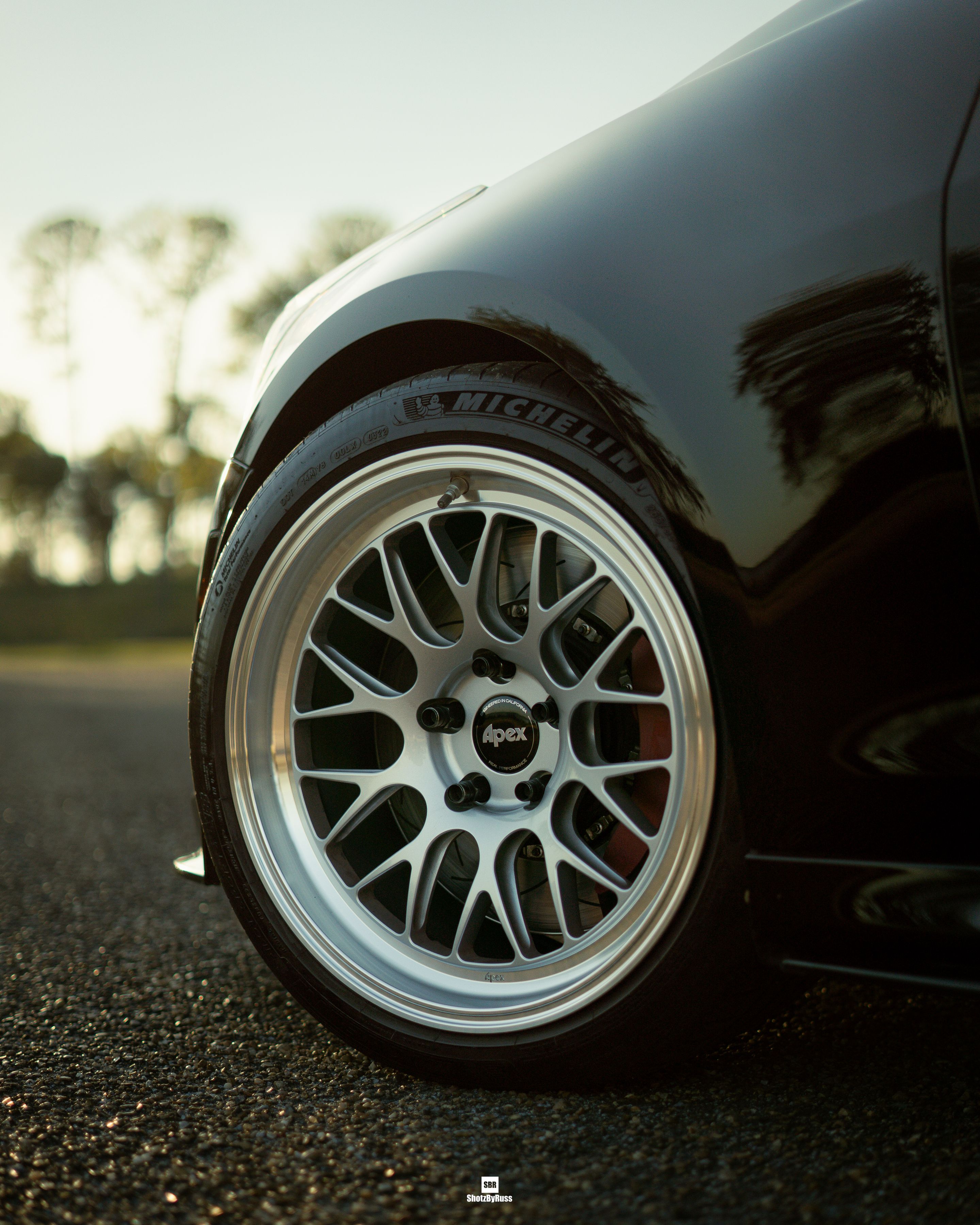 Black Cadillac ATS-V with 18" ML-10RT Apex wheels in Machined Lip Race Silver
