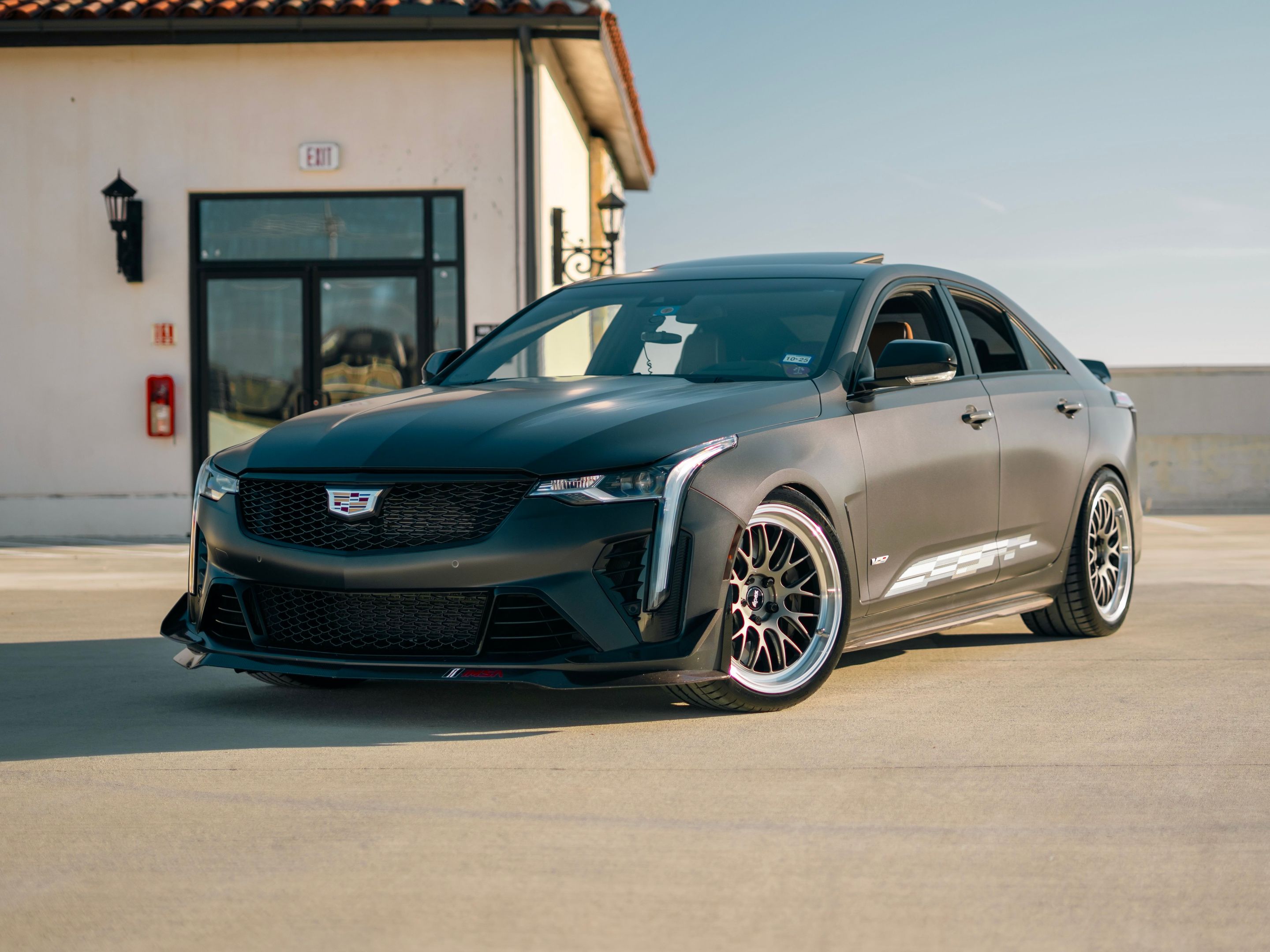 Black Cadillac CT4-V Blackwing with 19" ML-10RT Apex wheels in Machined Lip Anthracite