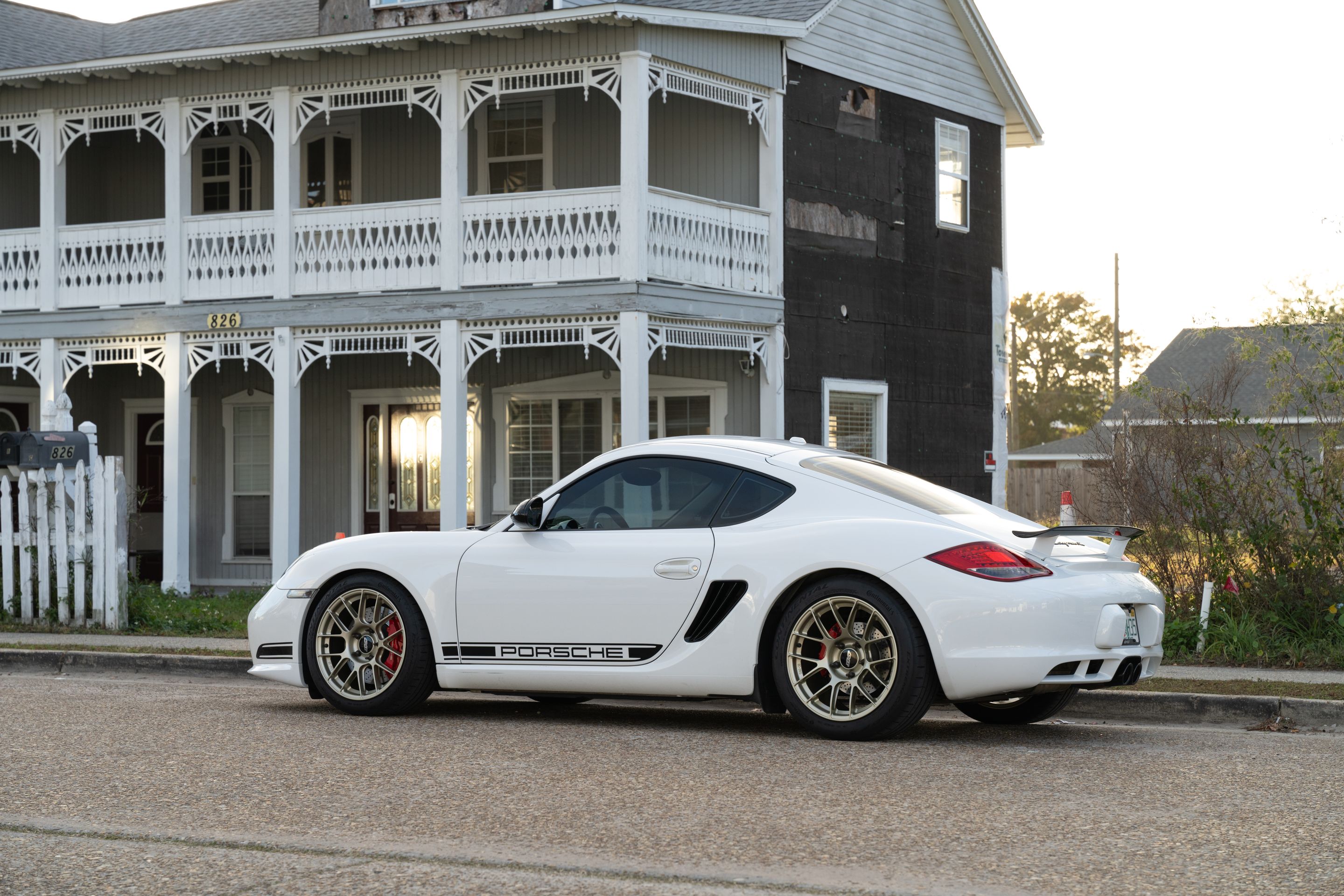 White Porsche 987 Cayman R with 18" EC-7RS Apex wheels in Motorsport Gold