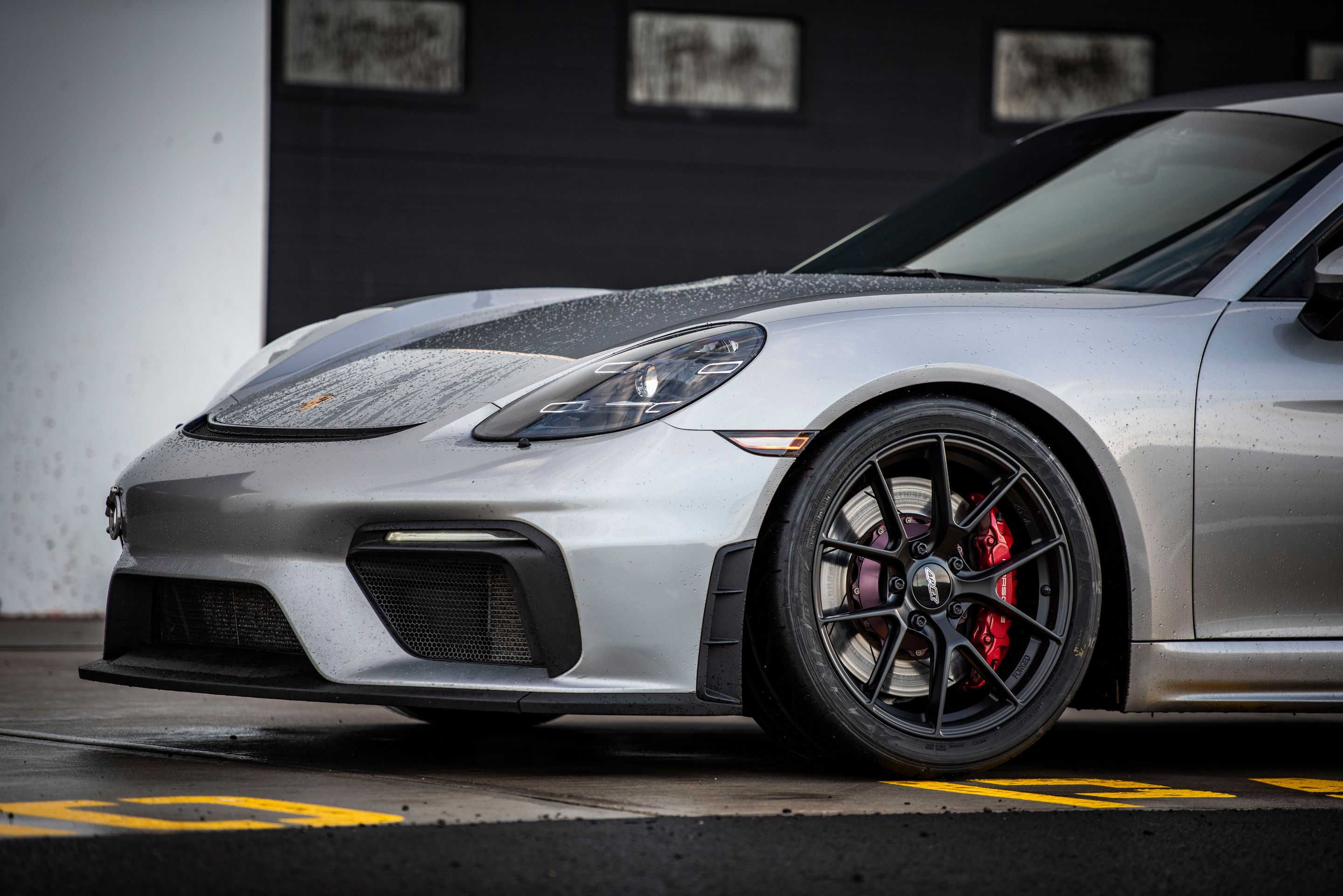 Silver Porsche 718 Cayman GT4 with 19" VS-5RS Apex wheels in Satin Black