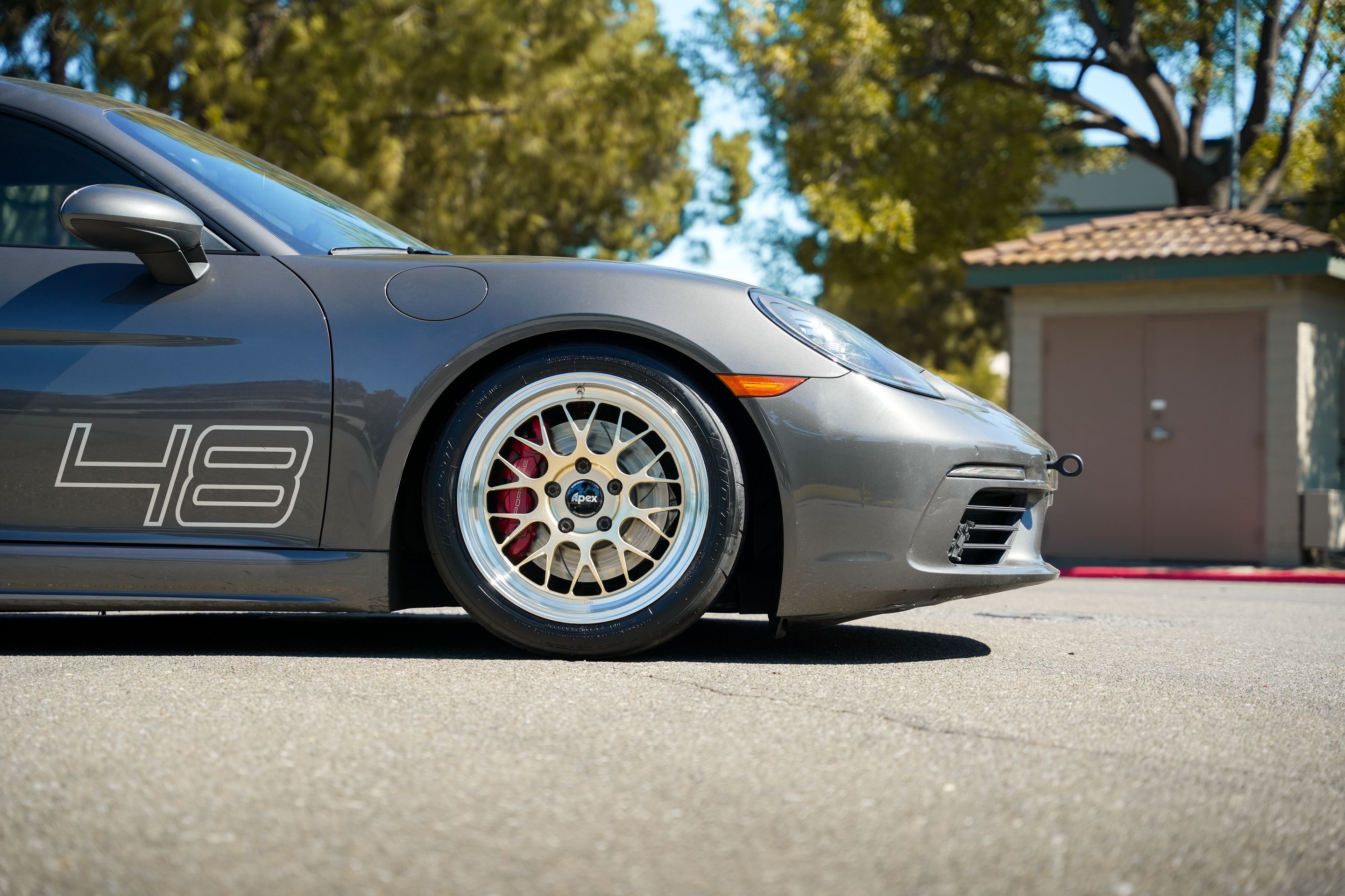 Grey Porsche 718 Cayman S with 18" ML-10RT Apex wheels in Machined Lip Gloss Motorsport Gold