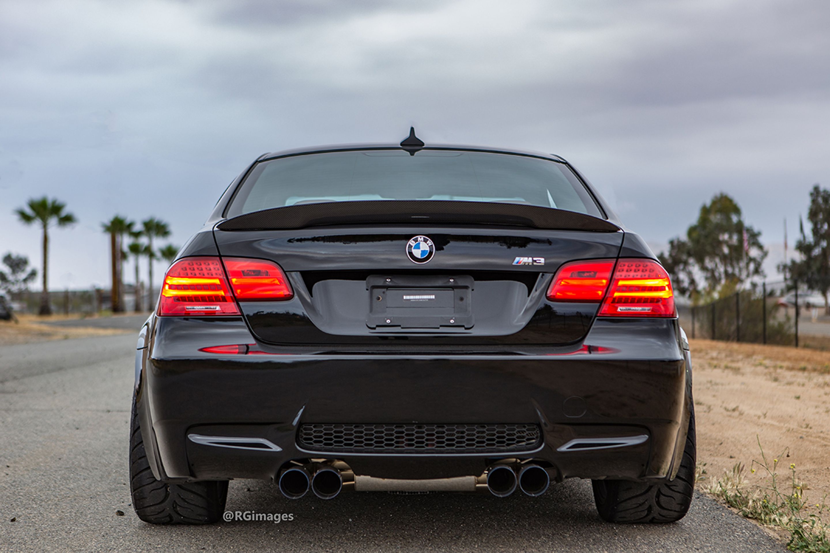 Black BMW E92 Coupe M3 with 18" ARC-8 Apex wheels in Satin Bronze