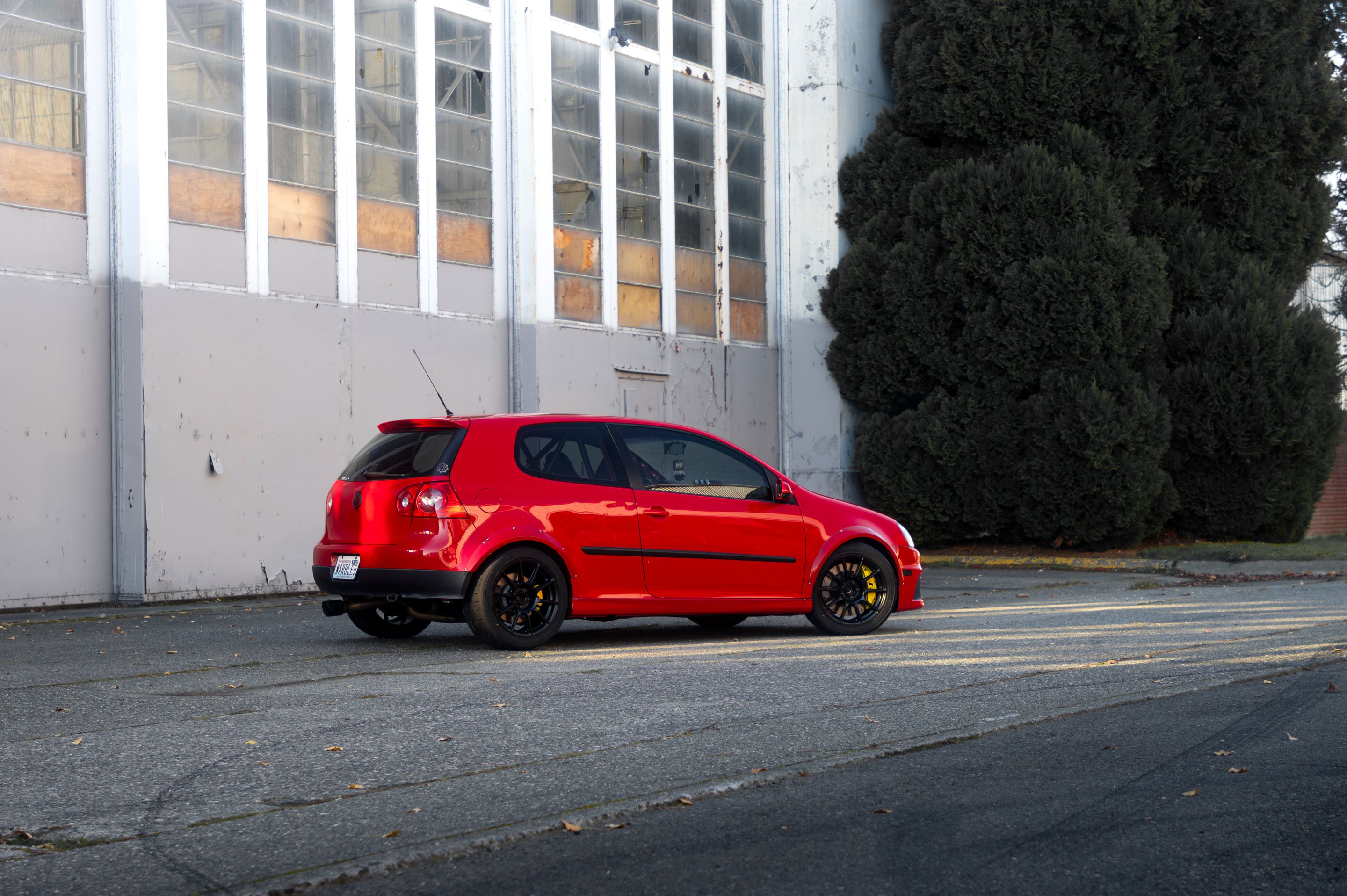 Red VW MK5 Golf with 17" SM-10 Apex wheels in Satin Black