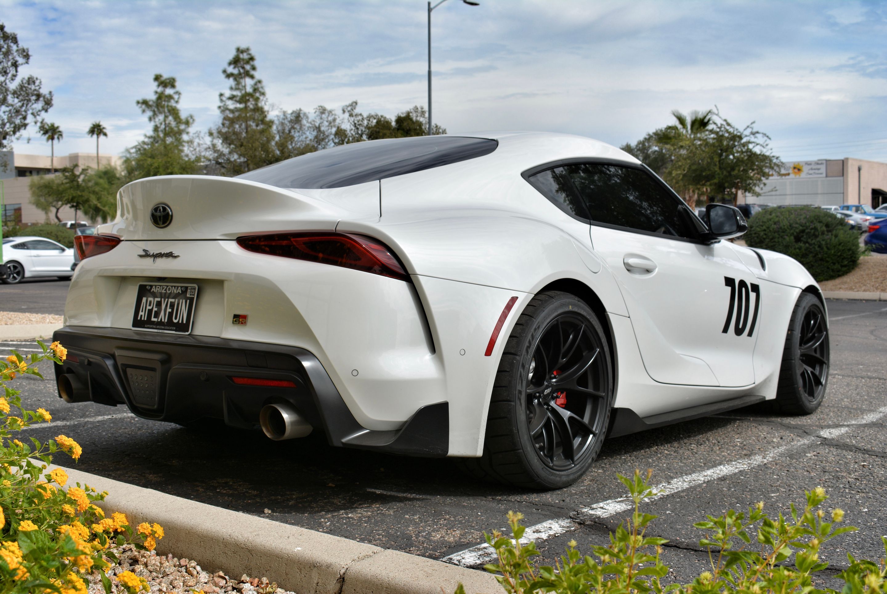 White Toyota GR Supra with 18" VS-5RS Apex wheels in Satin Black