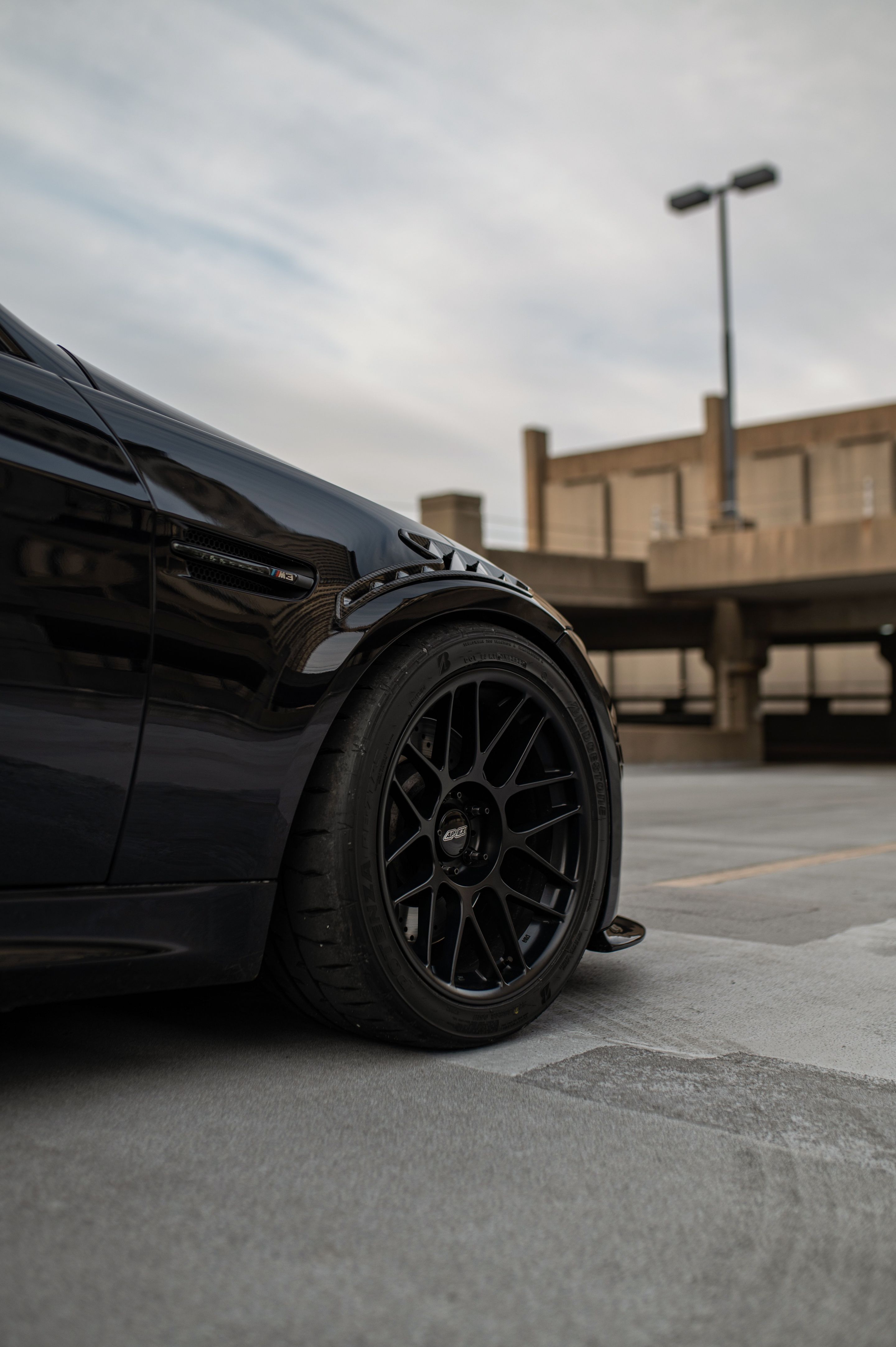 Black BMW E90 Sedan M3 with 18" ARC-8 Apex wheels in Satin Black