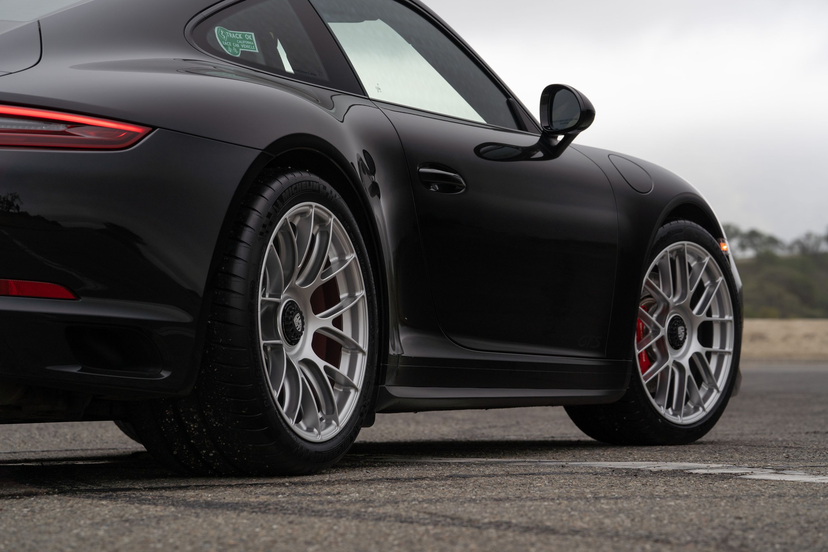 Black Porsche 911 991.2 Carrera GTS with 19" EC-7RS Apex wheels in Race Silver