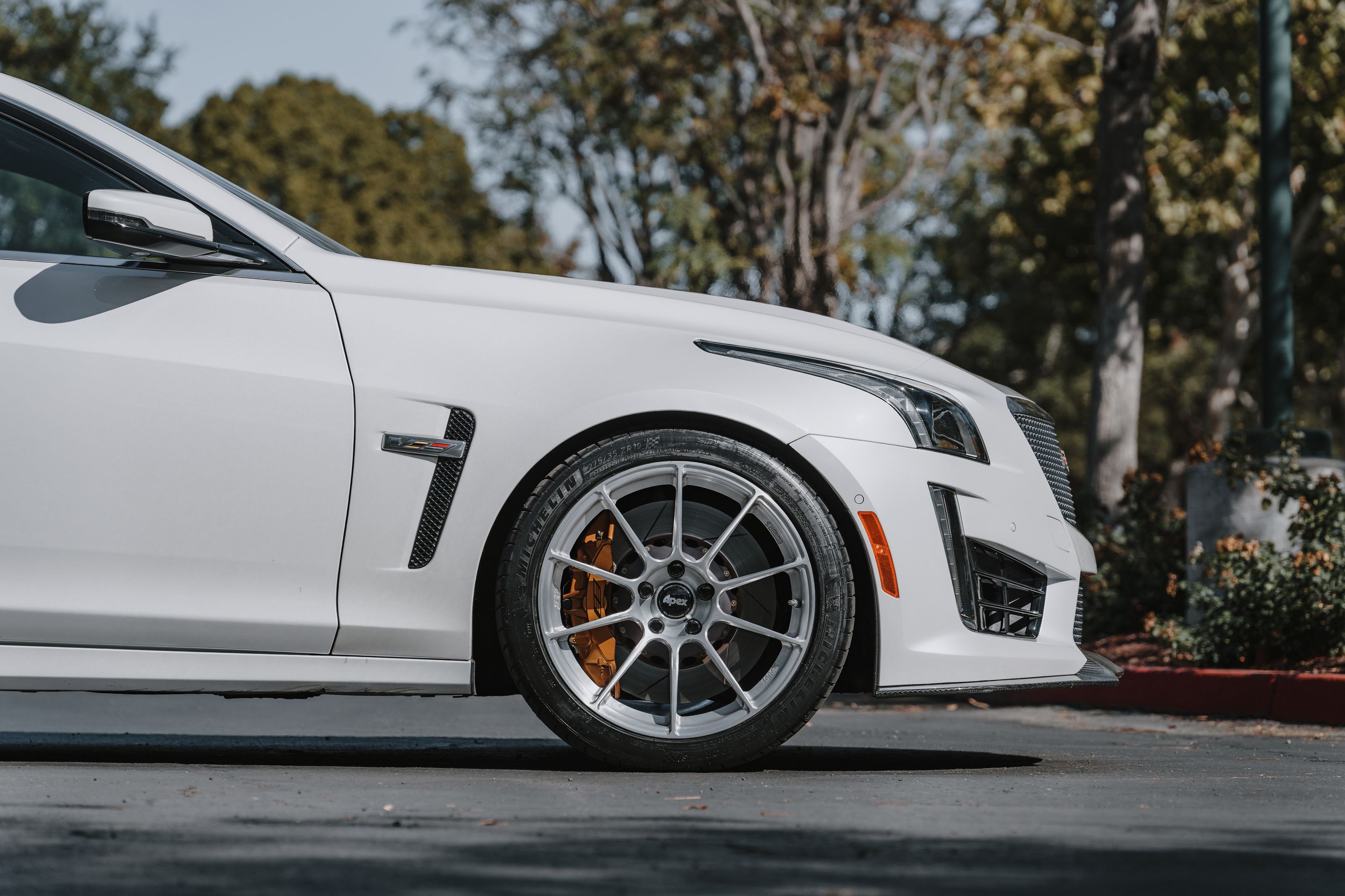 White Cadillac Gen 3 CTS-V with 19" SM-10RS Apex wheels in Brushed Clear