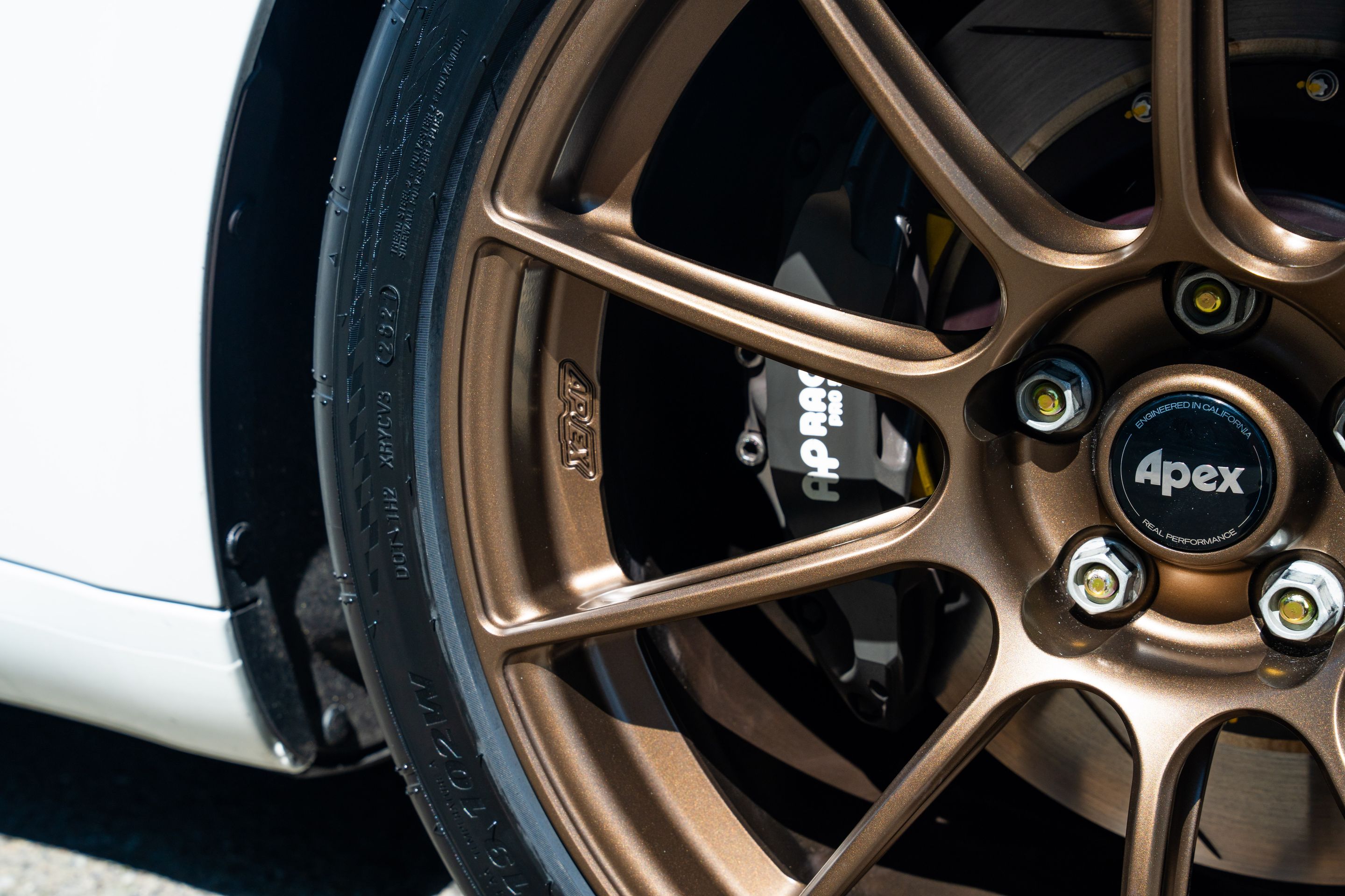 White Tesla Model 3 with 19" SM-10RS Apex wheels in Satin Bronze