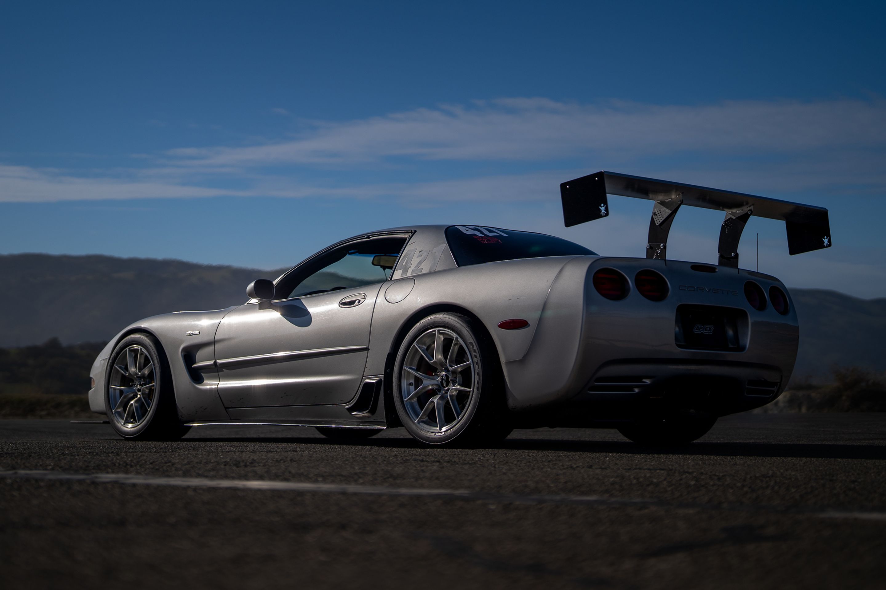 Silver Chevrolet C5 Corvette Z06 with 18" VS-5RS Apex wheels in Brushed Clear