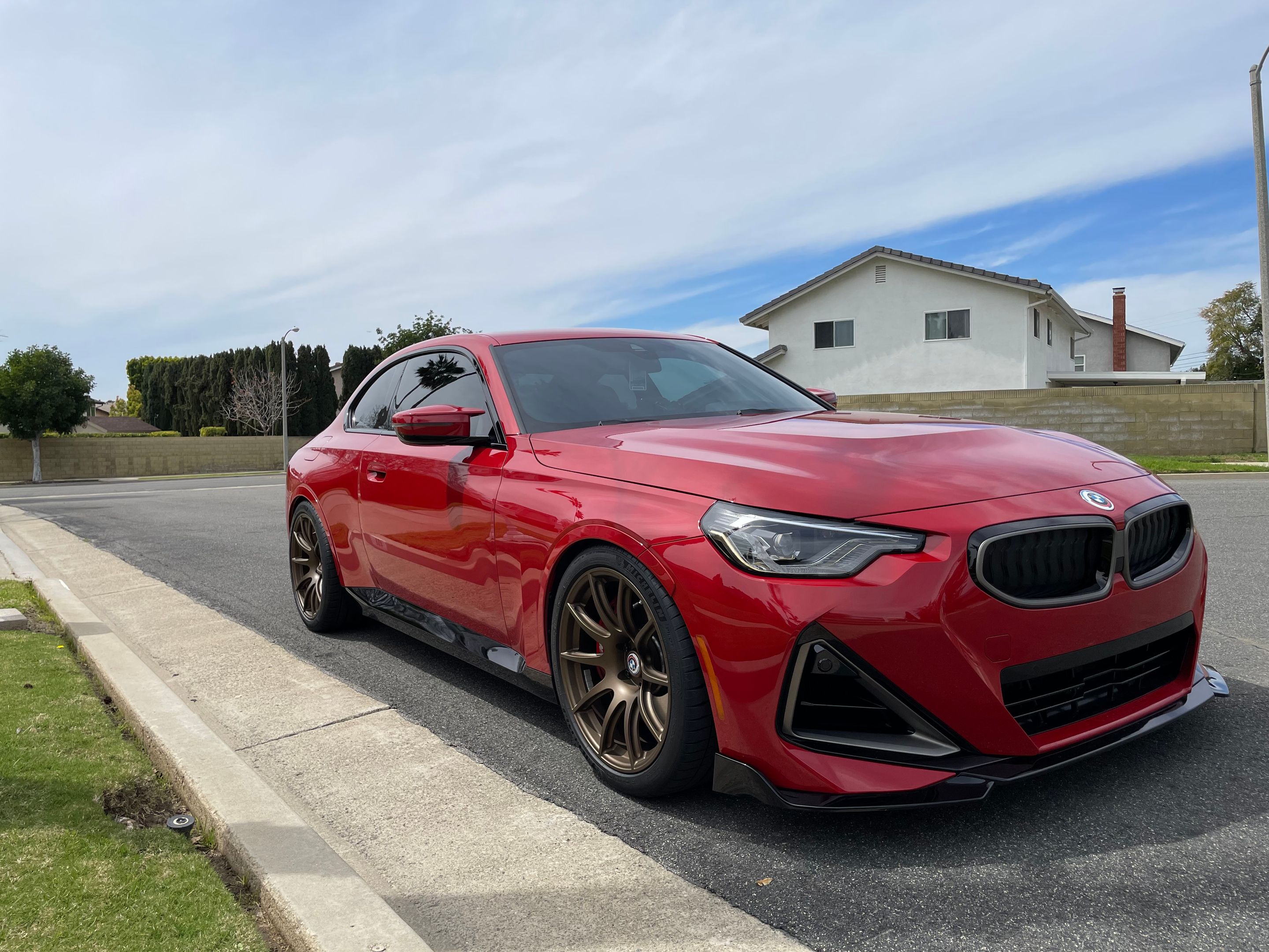 Red BMW G42 2 Series with 19" SM-10 Apex wheels in Satin Bronze