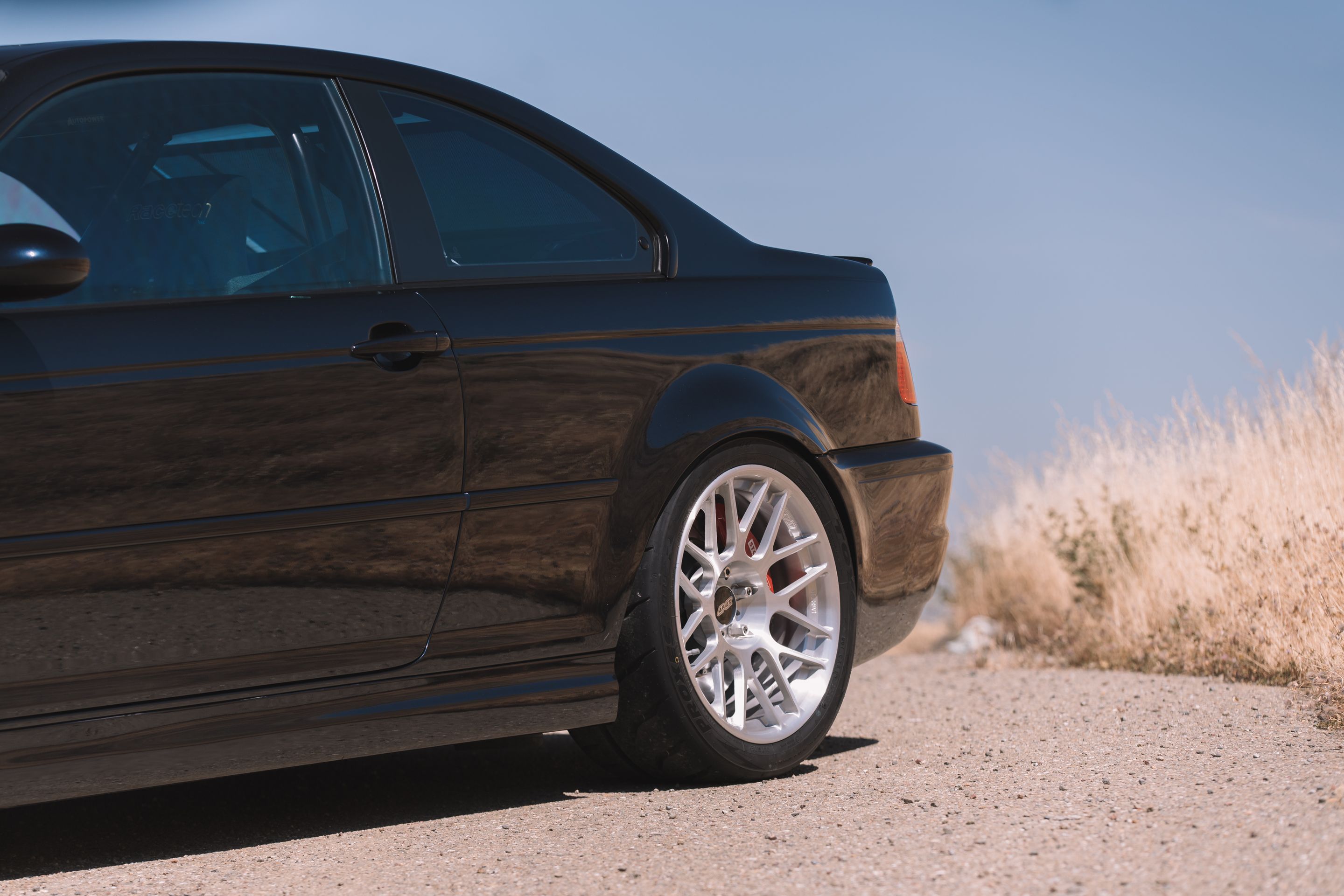 Black BMW E46 M3 with 18" ARC-8R Apex wheels in Brushed Clear
