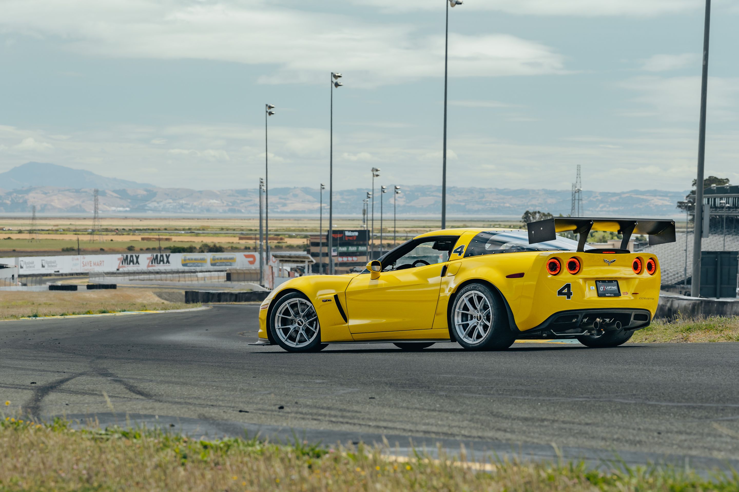 Yellow Chevrolet C6 Corvette Z06 with 18" VS-5RS Apex wheels in Brushed Clear
