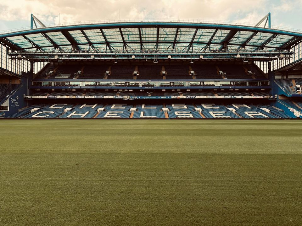 A large empty stadium with a sky background