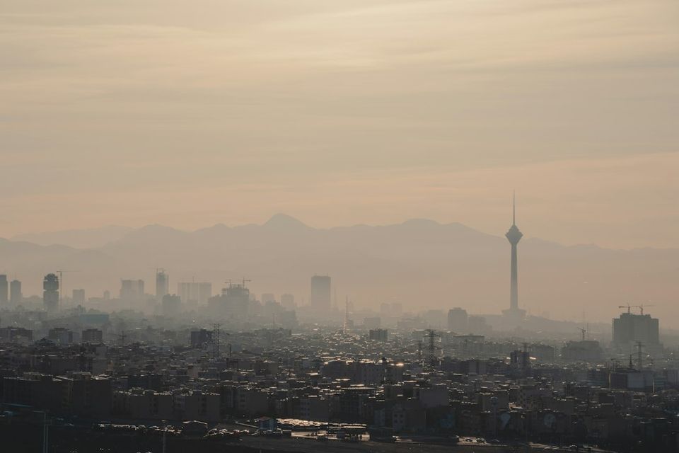 city skyline under white sky during daytime