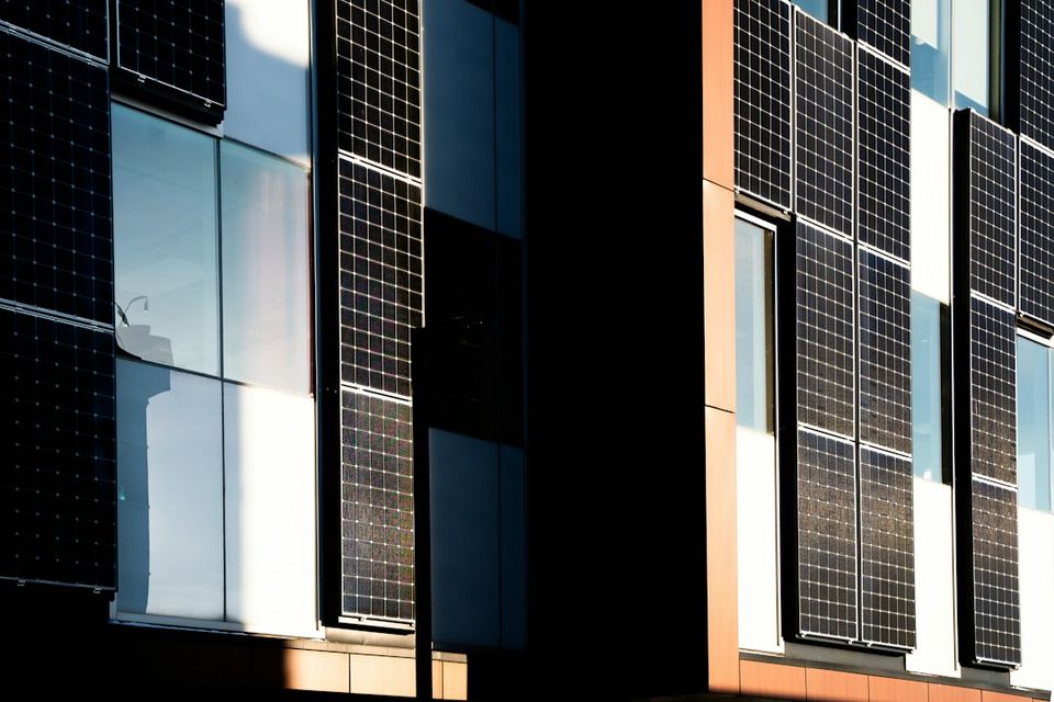 Modern building facade with integrated solar panels