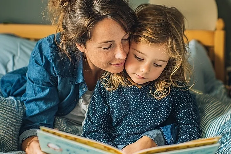mother and child reading a book together