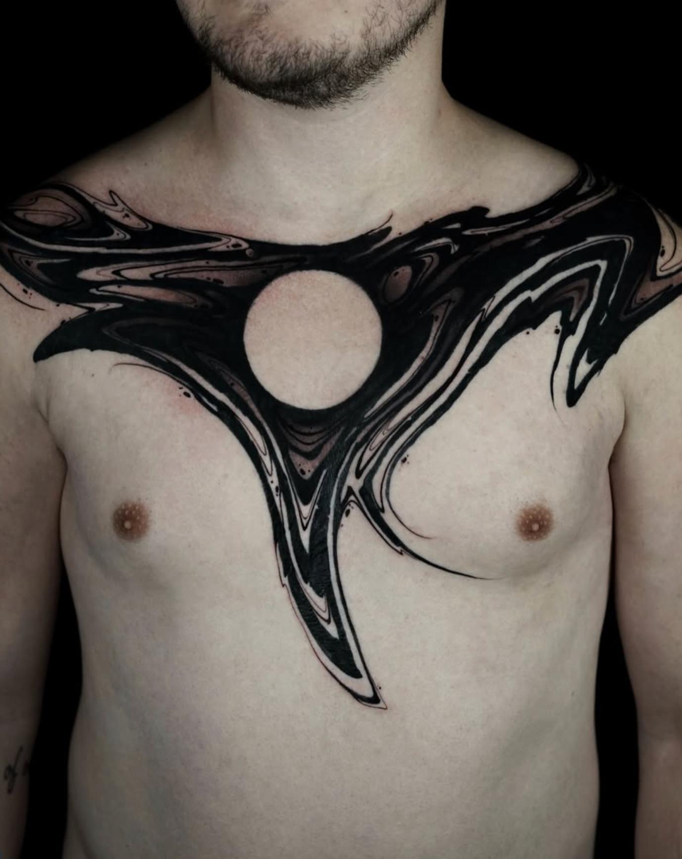 Blackwork abstract tattoo with swirling design on chest