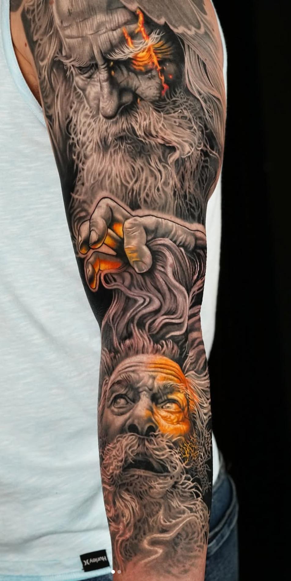 Black and grey realistic portrait sleeve with orange highlights