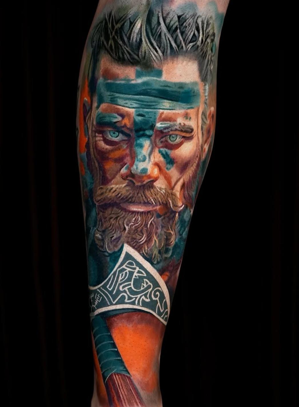 Colorful realistic Viking warrior tattoo on full leg sleeve