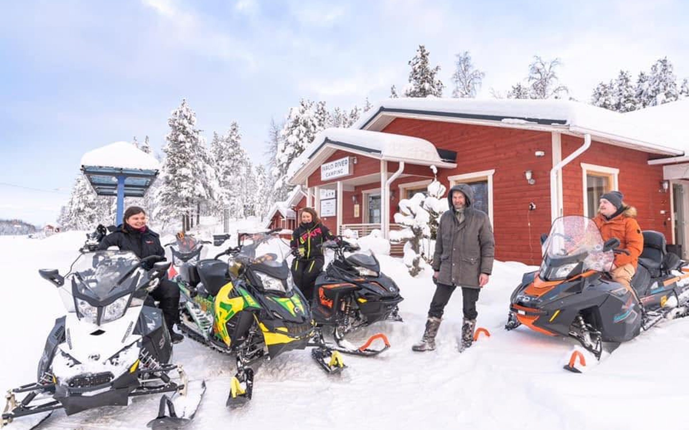 Snowmobile safari through a snowy winter landscape in Ivalo, Finnish Lapland