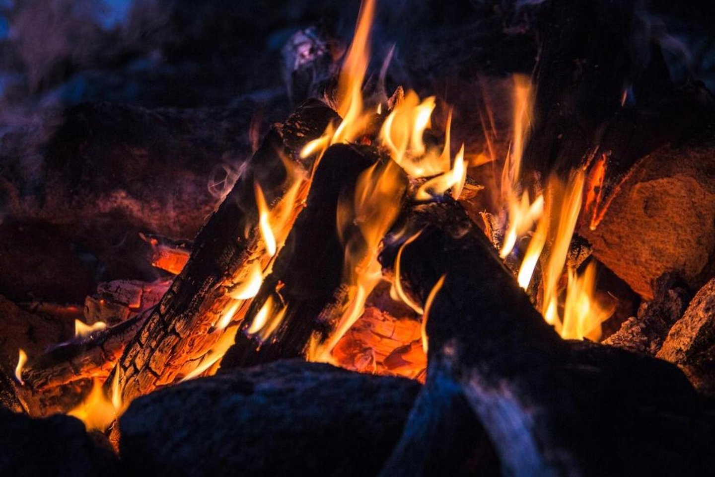 Flames glowing in a fire pit