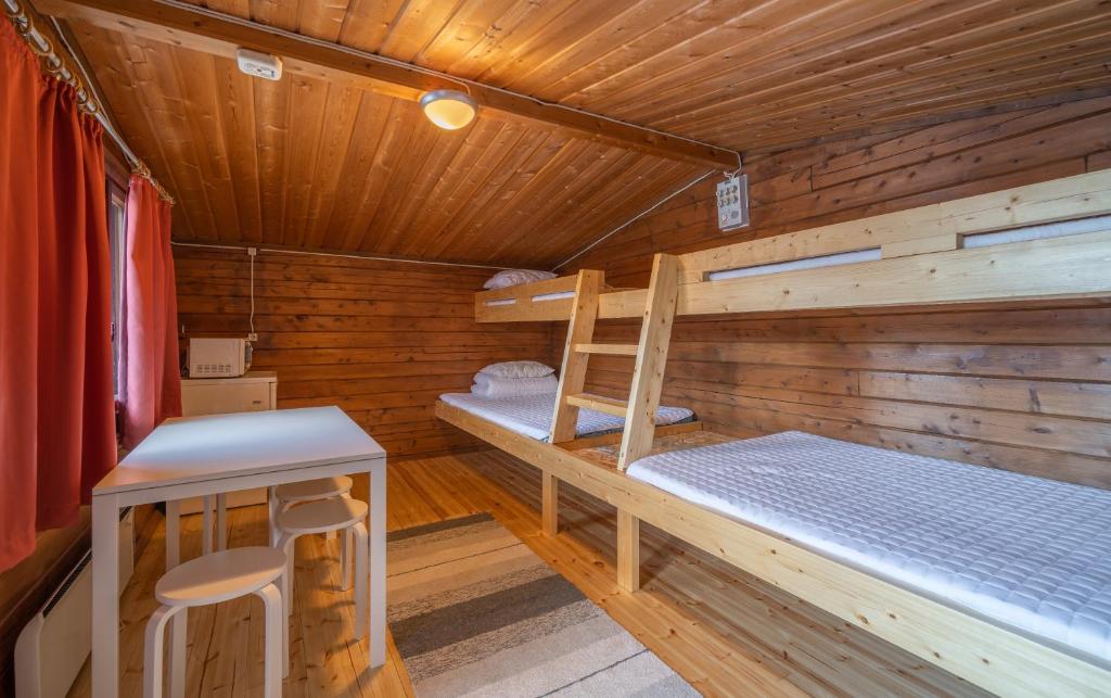 Cottage 11/12 at Ivalo River Camping, accommodation for four guests