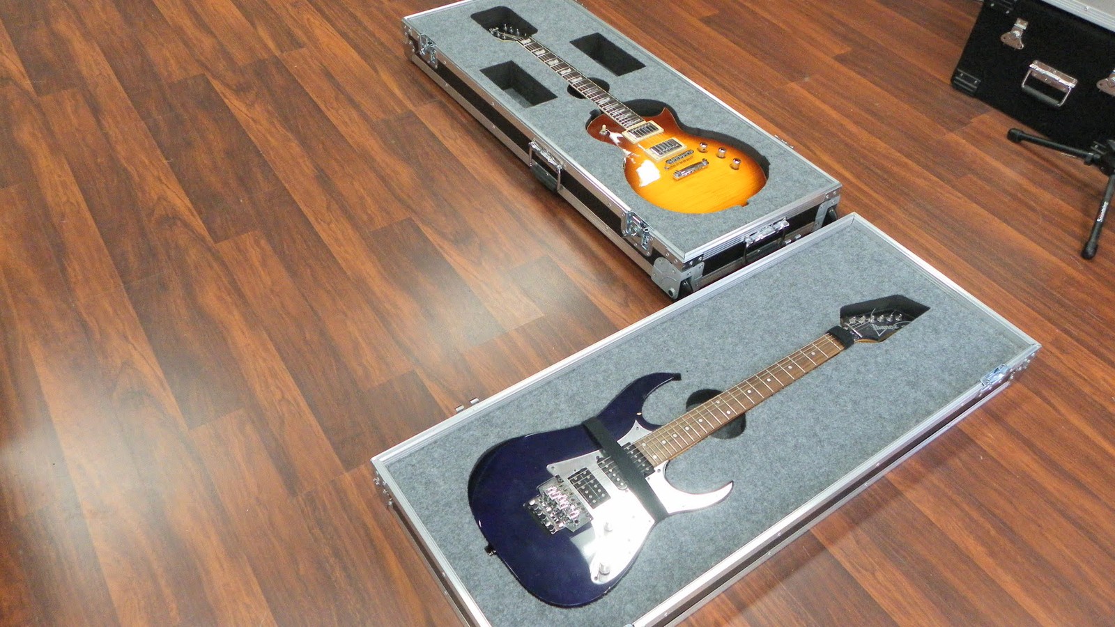 Custom Double Guitar Case Laying On Top Of Each Other