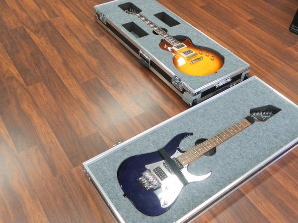 Custom Double Guitar Case Laying On Top Of Each Other