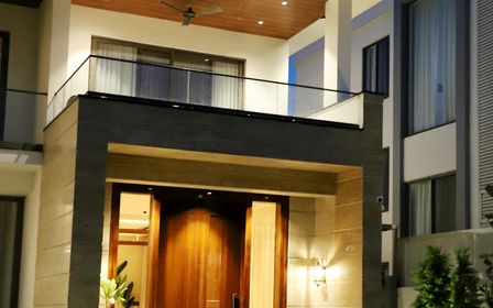 Modern luxury home illuminated at night