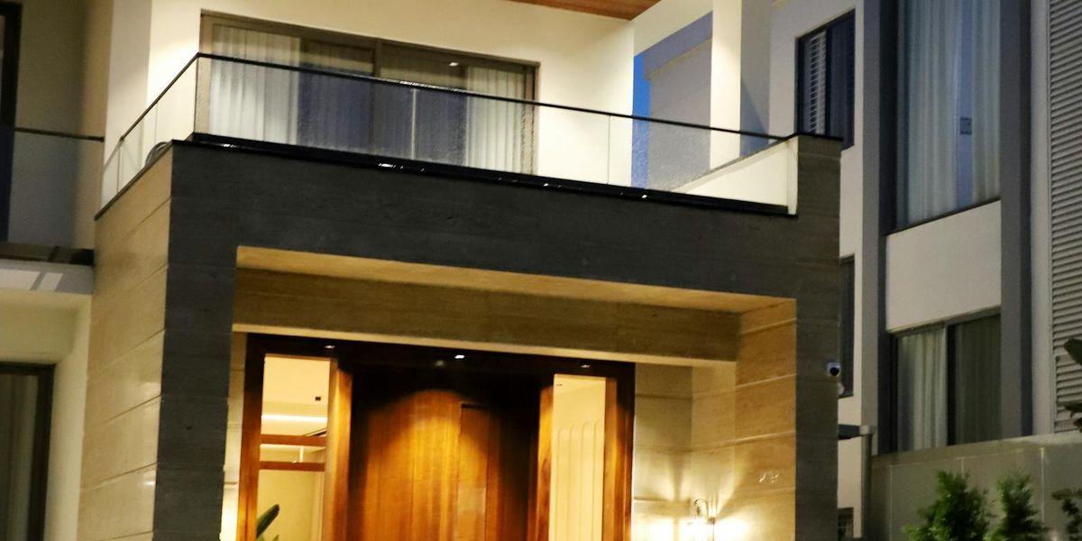 Modern luxury home illuminated at night
