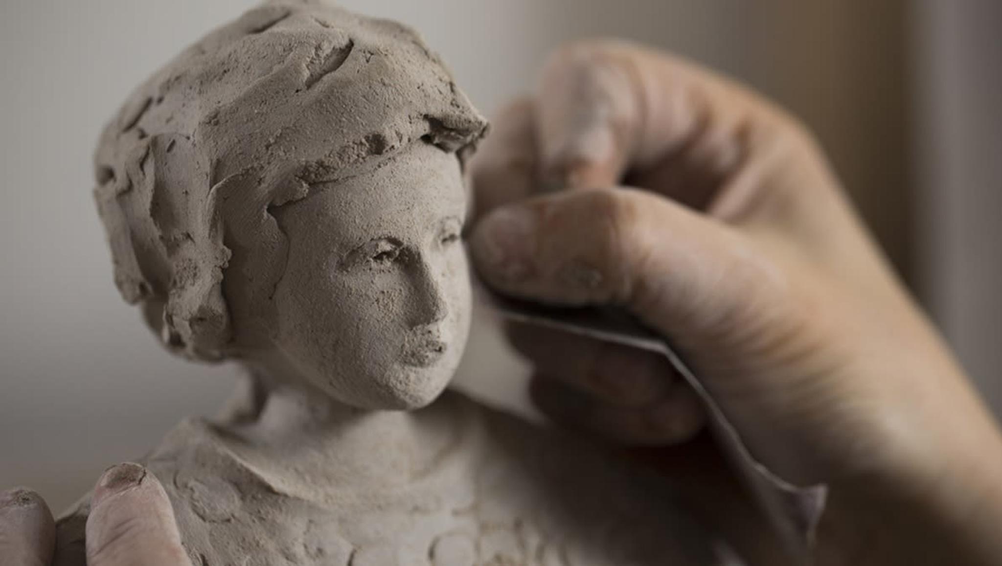 Detail of Paola Staccioli working on her sculpture
