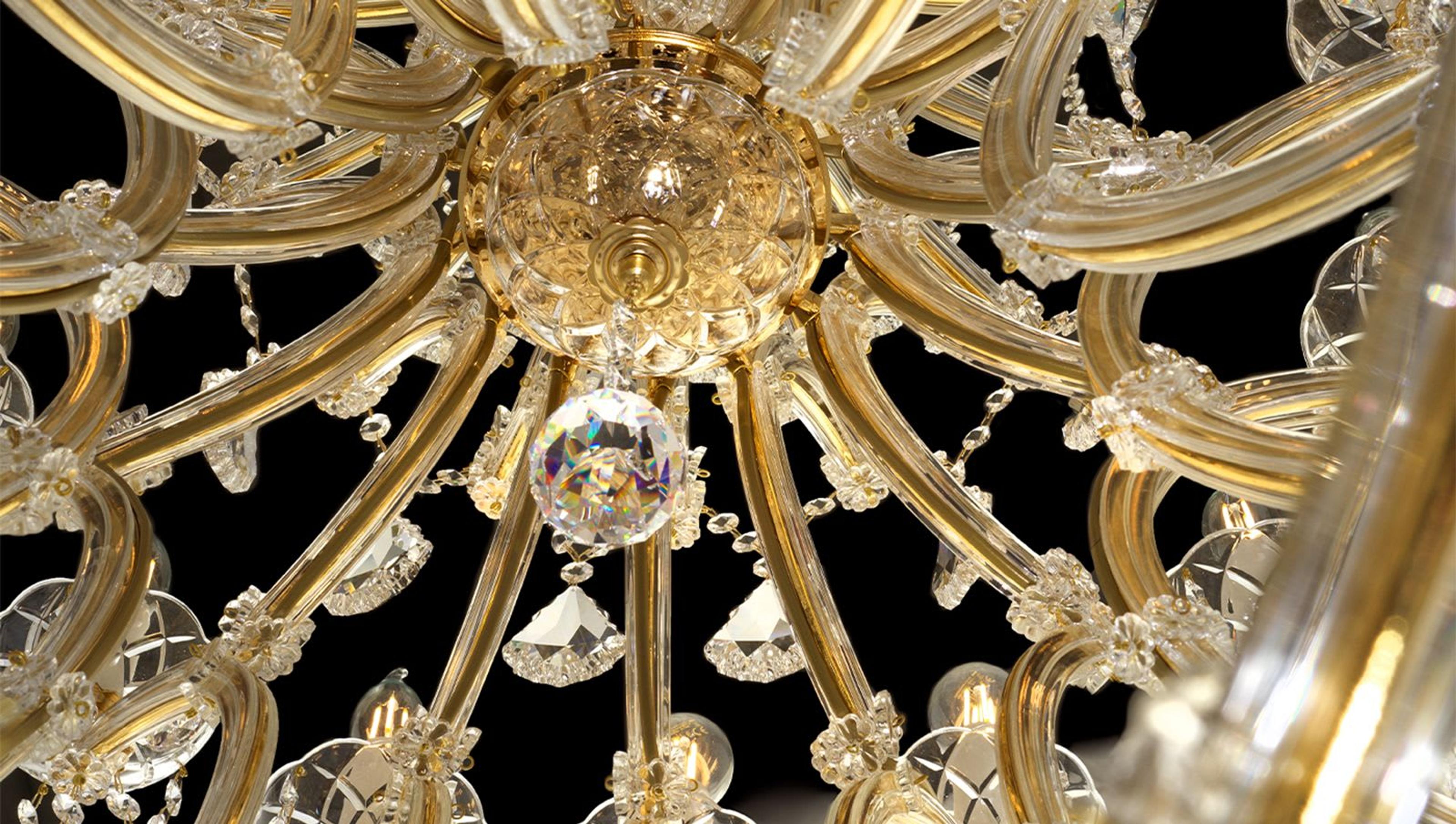 A close-up into the sculptural masterpiece by Il Paralume Marina, a 45-light gold chandelier enriched with crystal pendants
