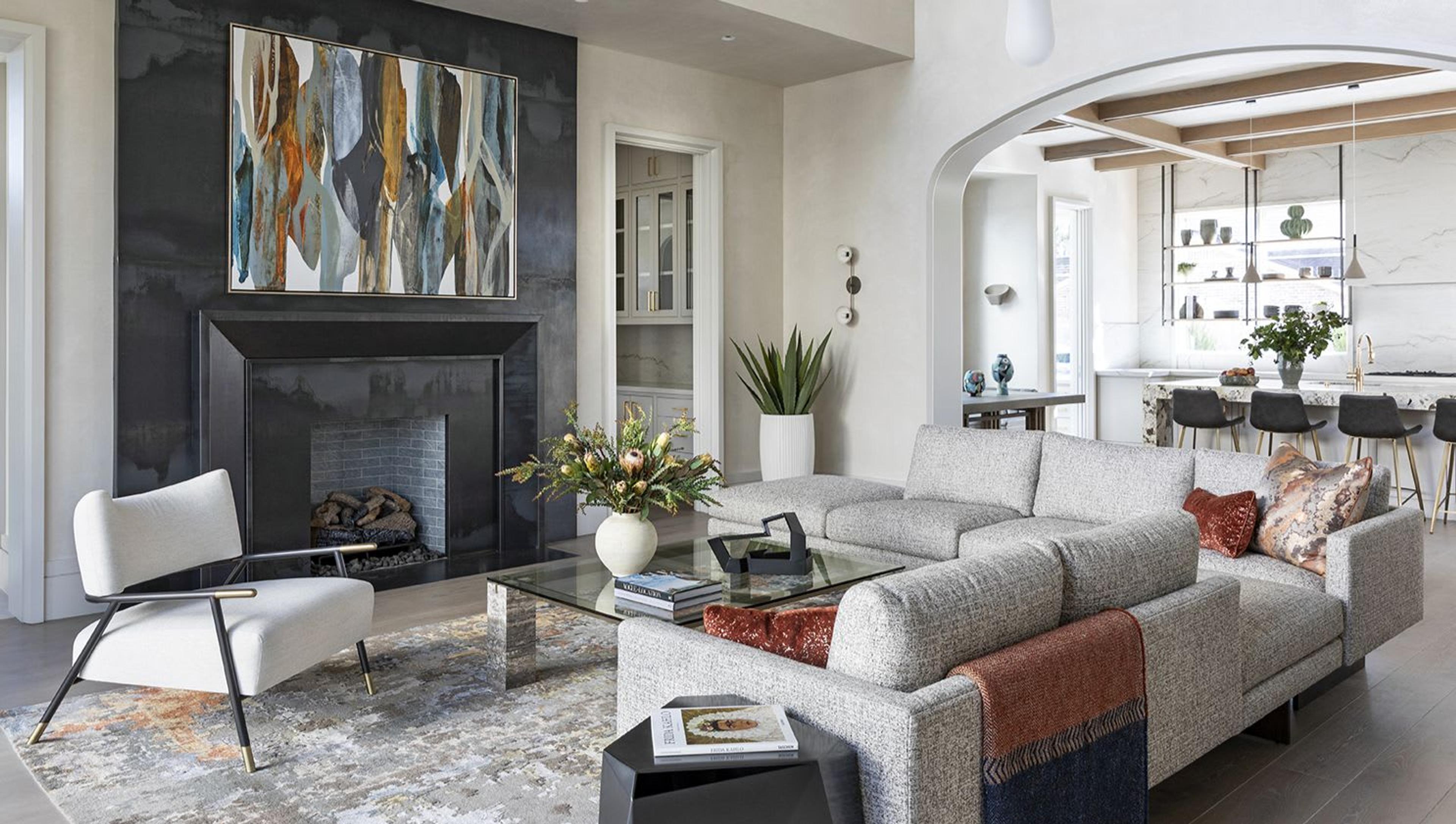 Connected to both the kitchen and the dining space, this living room offers ample seating and access to the home’s surrounding pool and grounds. The fireplace is particularly noteworthy as it is constructed from blackened steel, an aged metal finish with natural color variation and marbling that will continue to patina over time.