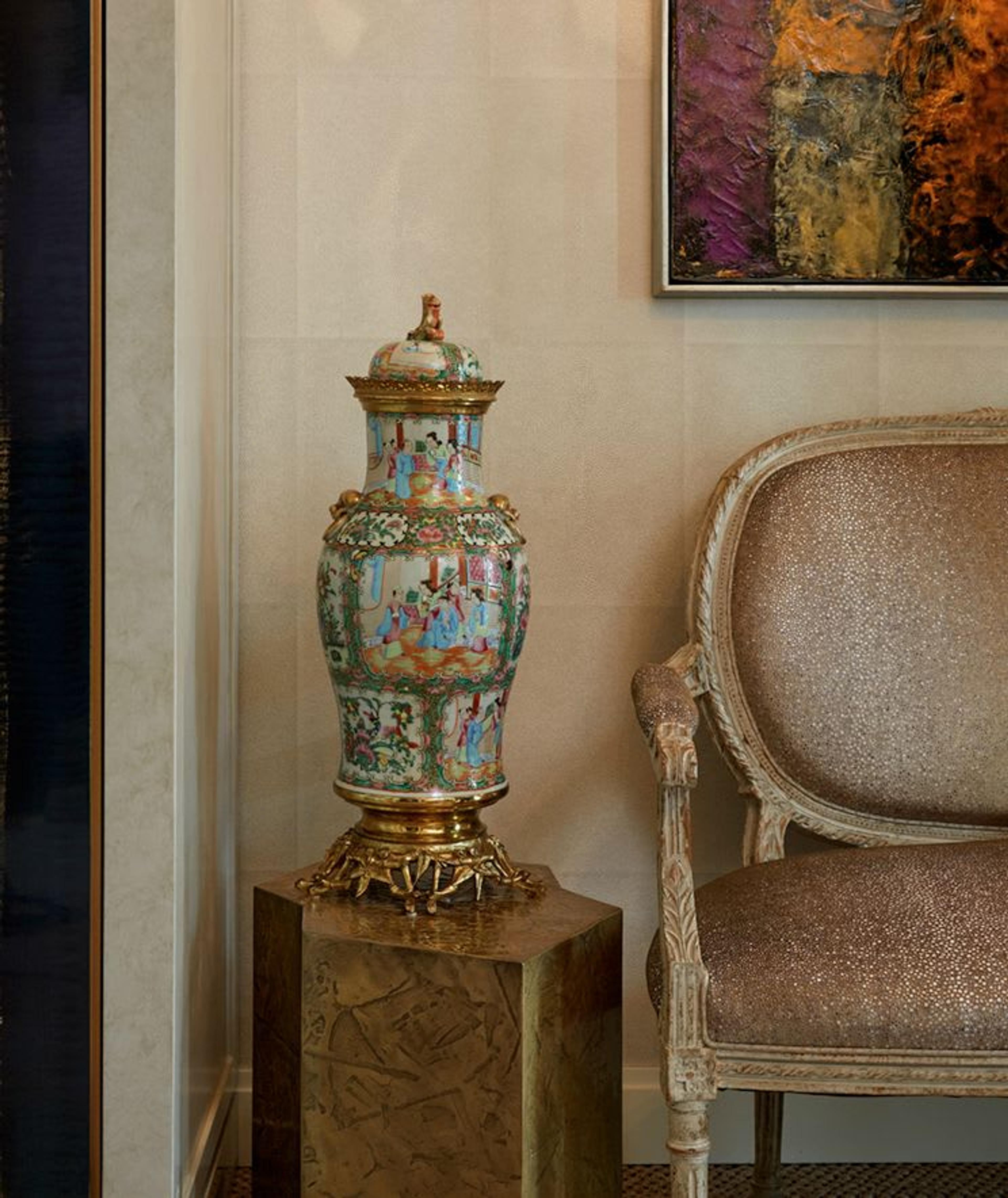 A french armchair lined with glittering fabric,Chinese porcelain and a beautiful brass side table