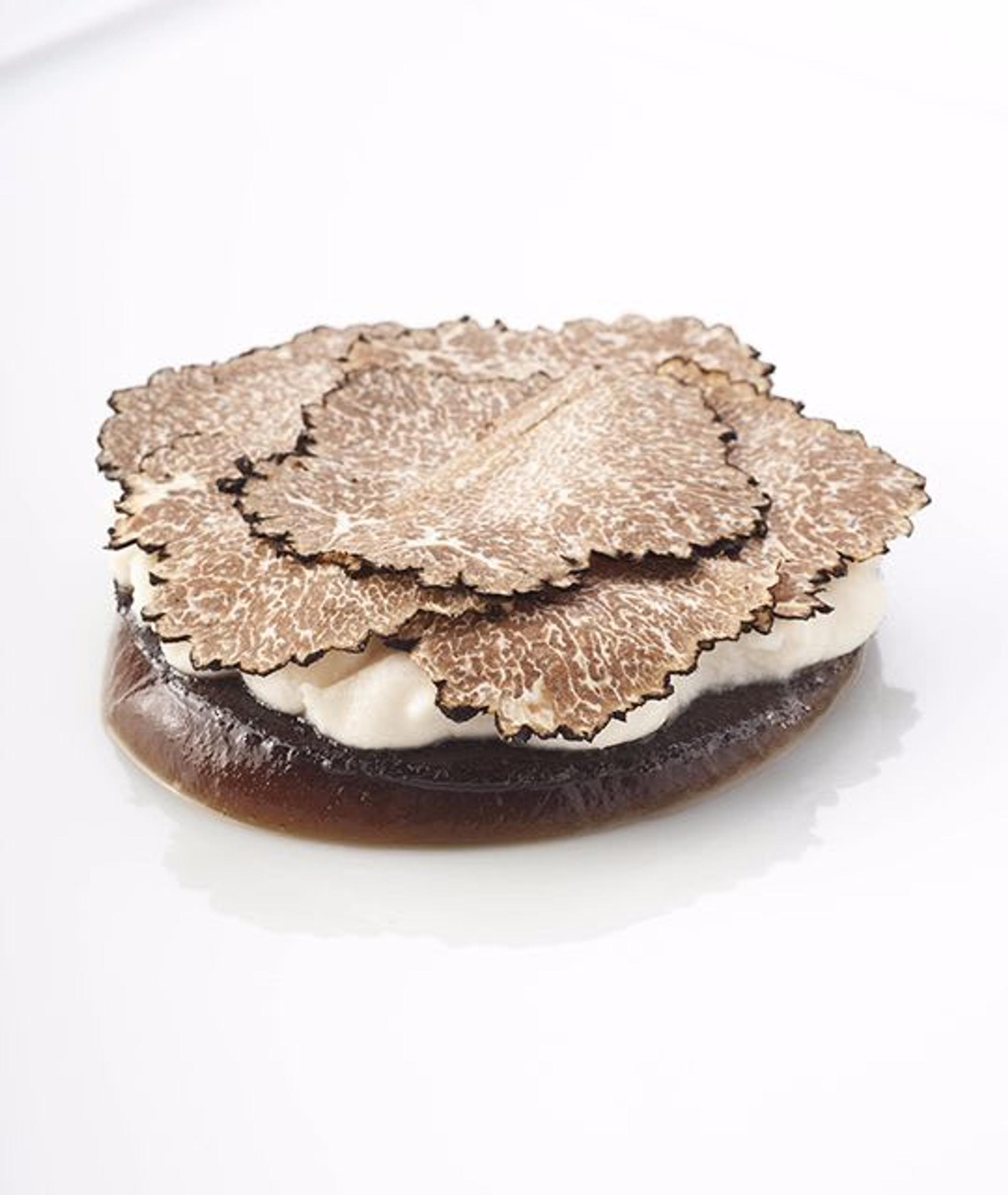 Beautiful dishes are created by Chef Niko Romito. On photo: Veal jelly, dried porcini, almonds and black truffles.