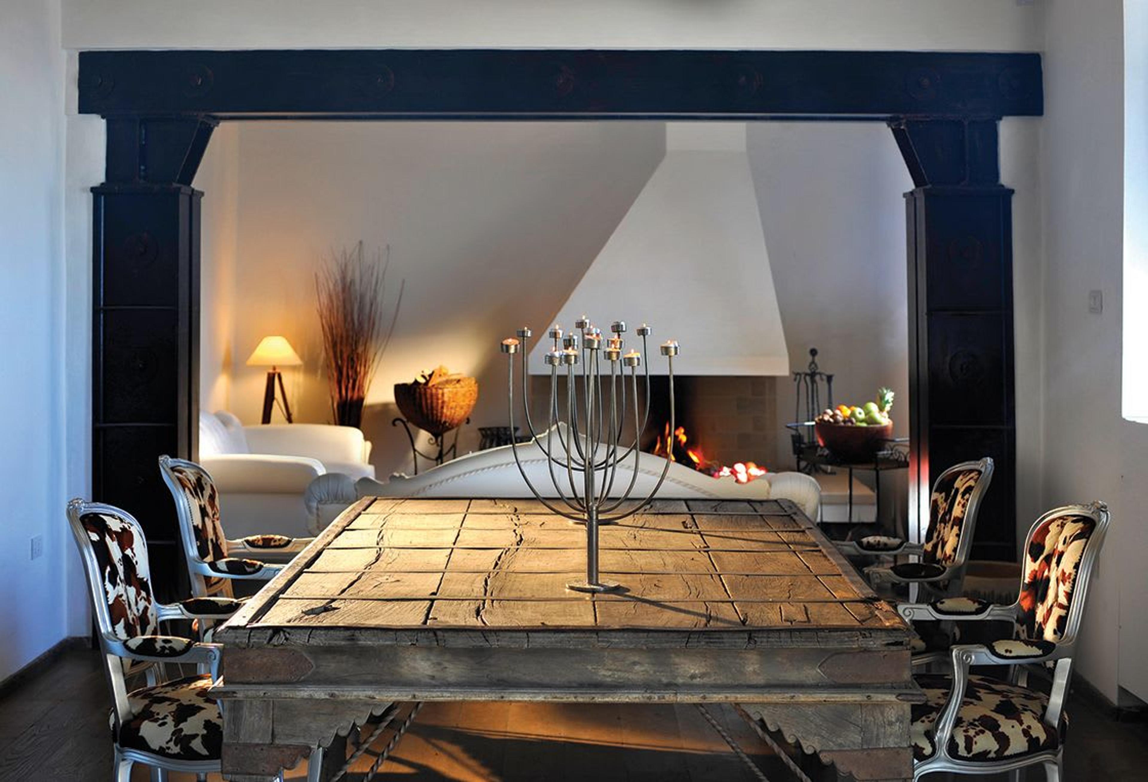 Interiors of Faro Capo Spartivento, featuring contemporary furniture and home décor pieces and the lighthouse original features and finishes