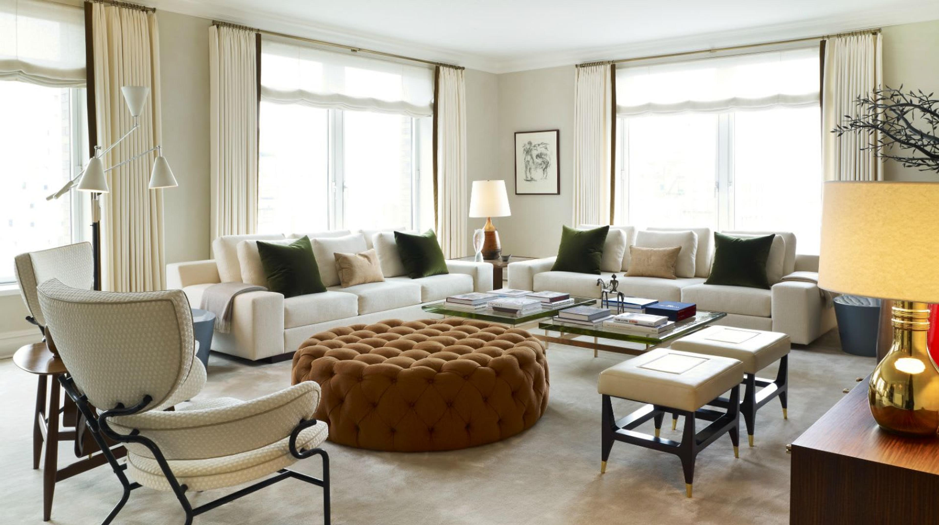View of a Park Avenue NYC apartment living room featuring beautifully crafted leather stools by Raphael Raffel
