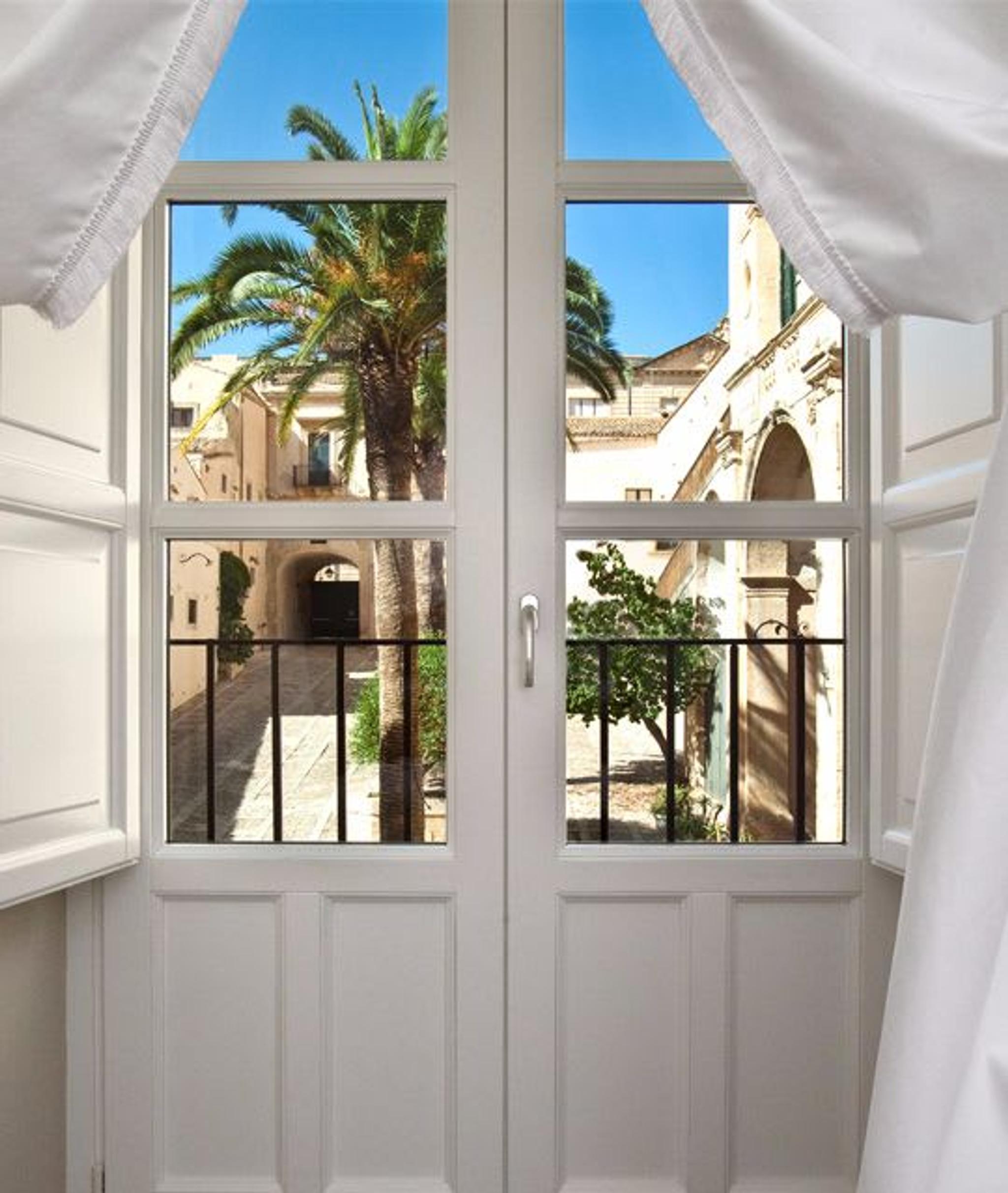 View of the baroque town of Noto from one of the rooms of Seven Rooms Villadorata