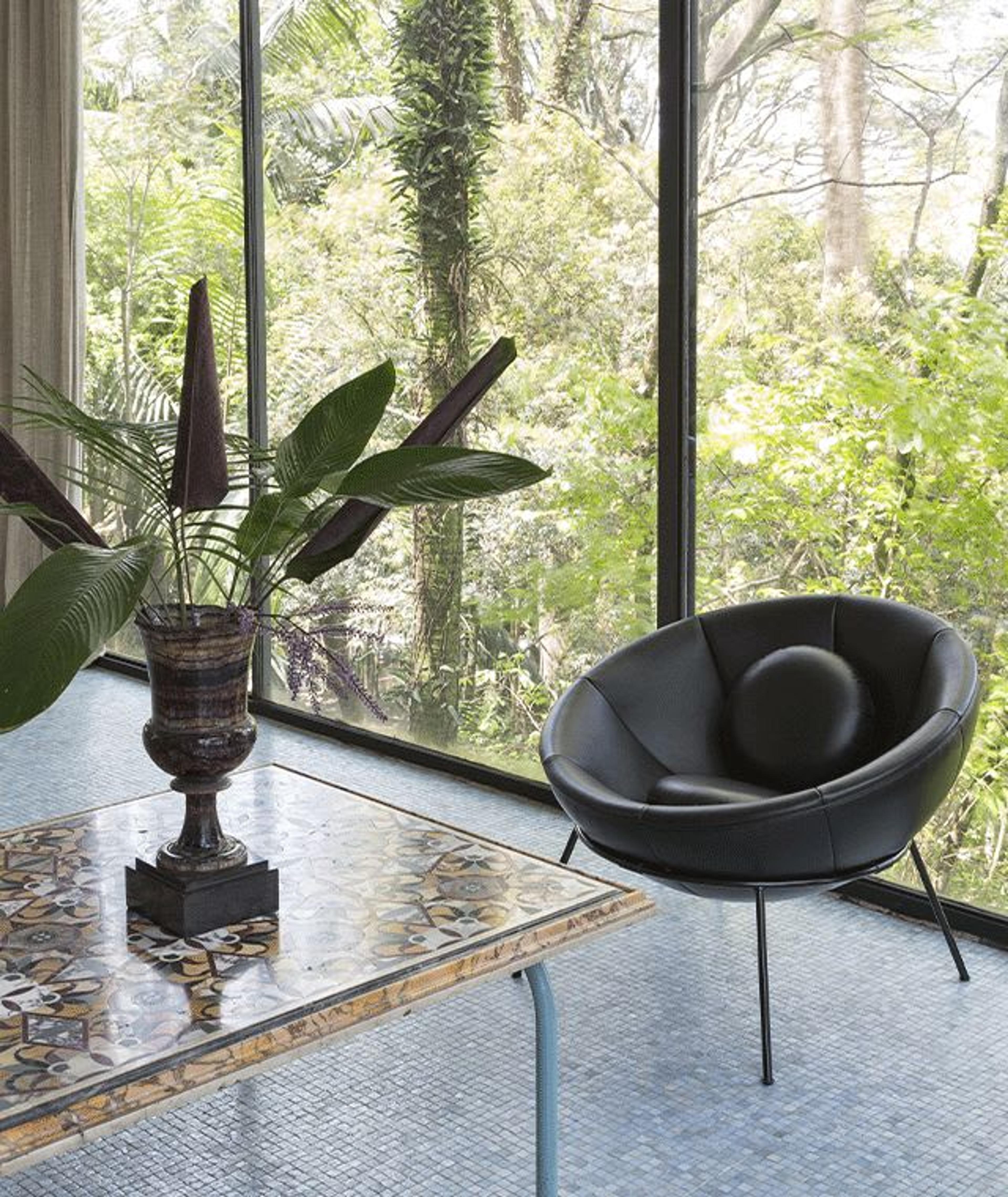 Interiors of Casa De Vidro with Arper Bowl Chair. Photography by Ruy Teixeira.