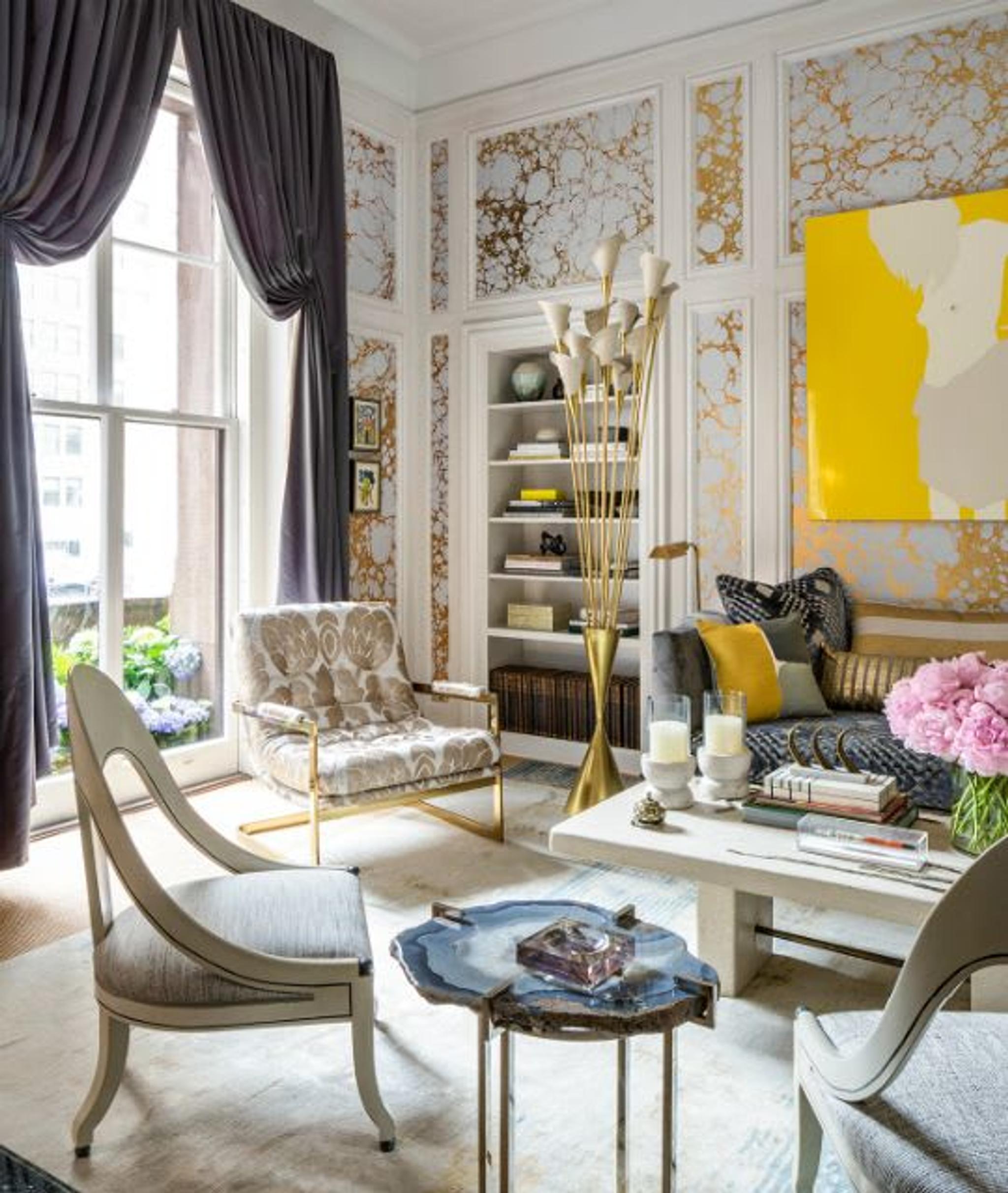 Blue-gray satin curtains are pulled to reveal doors to a terrace.  Marbleized wallpaper is inset within the room’s original paneling.  Mid-century, Italian, calla lily floor lamp acts a sculpture in the room.