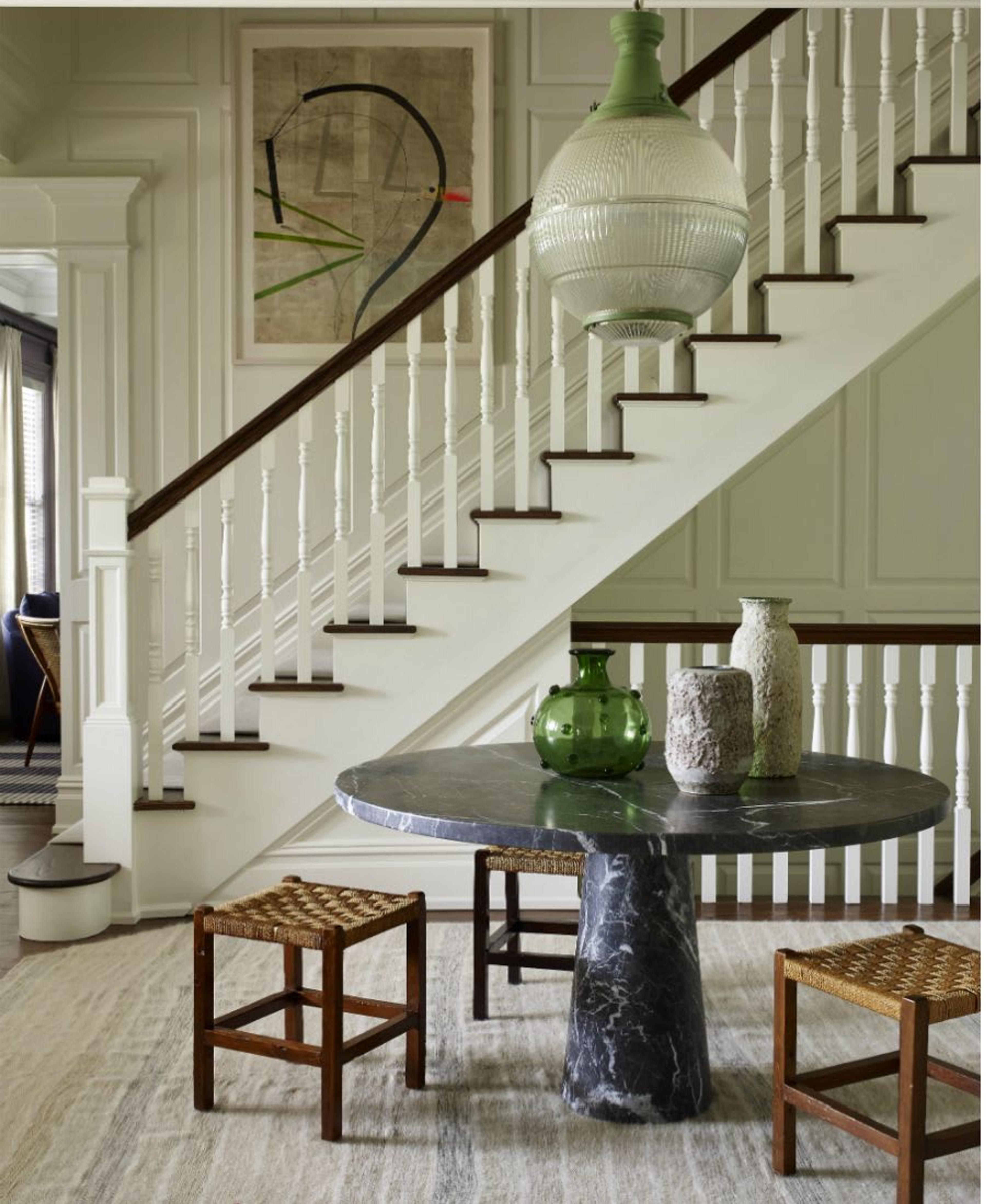 Elegant entry way of Bridgehamption New York Home featuring a splendid Made in Italy black marble round table by Angelo Mangiarotti